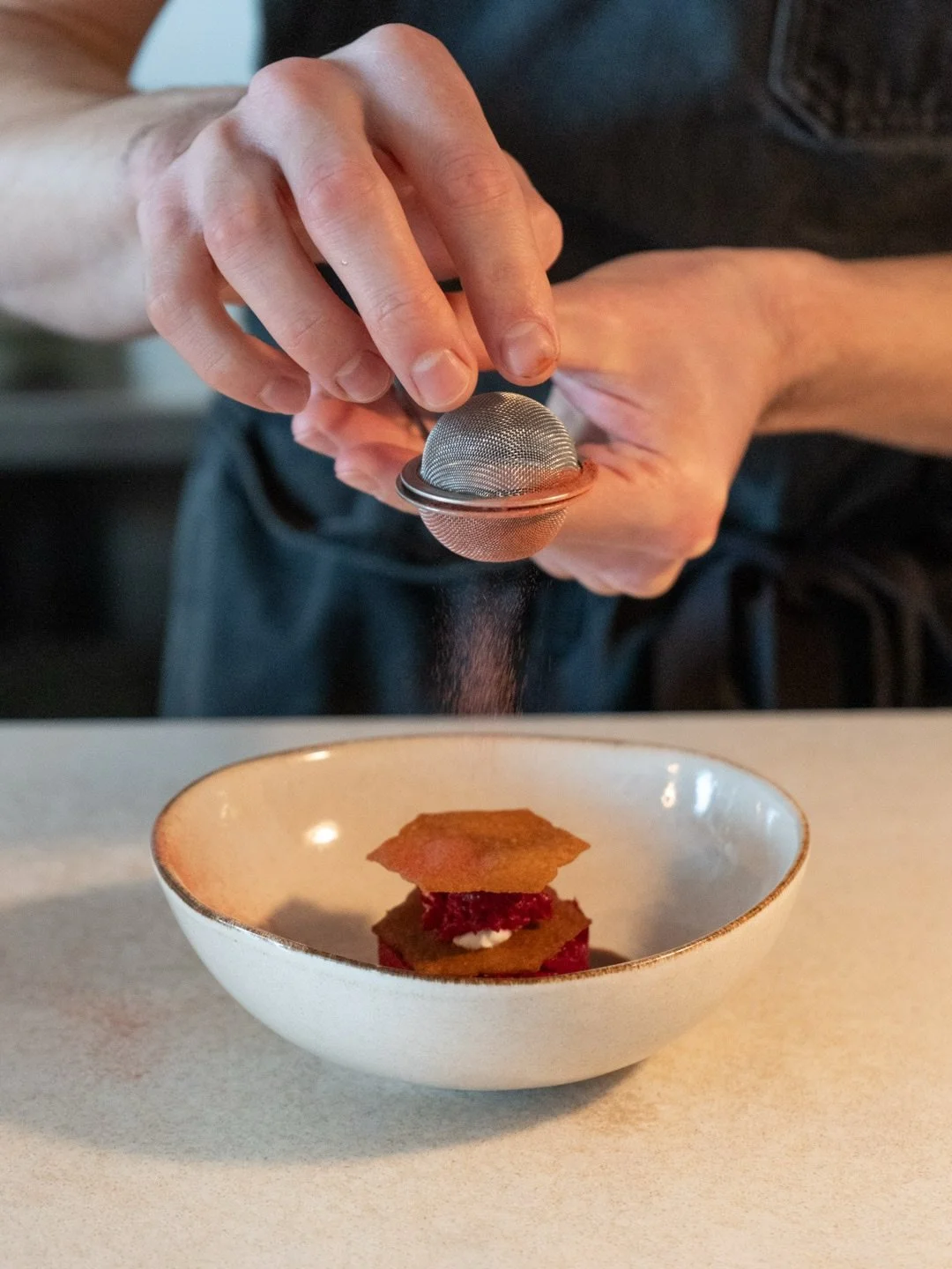 pickled &amp; smoked: a savory play on a mille-feuille with layers of smoked almond ricotta, beet crisps, and a tartare of marinated beet, ponzu compressed watermelon, and pickled watermelon rind. finished with a balsamic &amp; beet reduction and a l