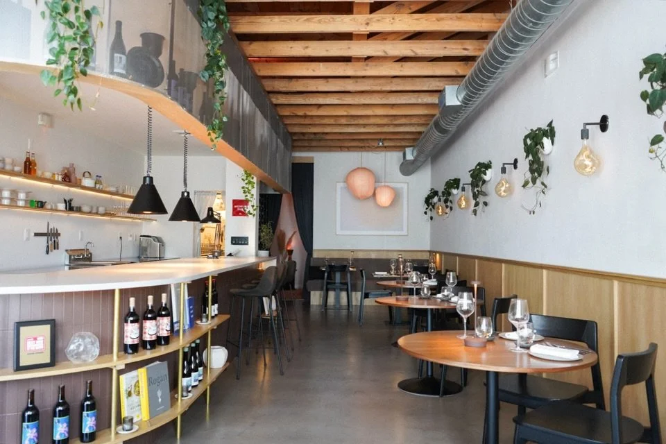 Just overhead, exposed wooden beams and locally-made limestone bricks are on display - elements of the original 1939 construction of Tarrytown Shopping Center. We love showcasing the craftsmanship of these little pieces of history up above, juxtapose