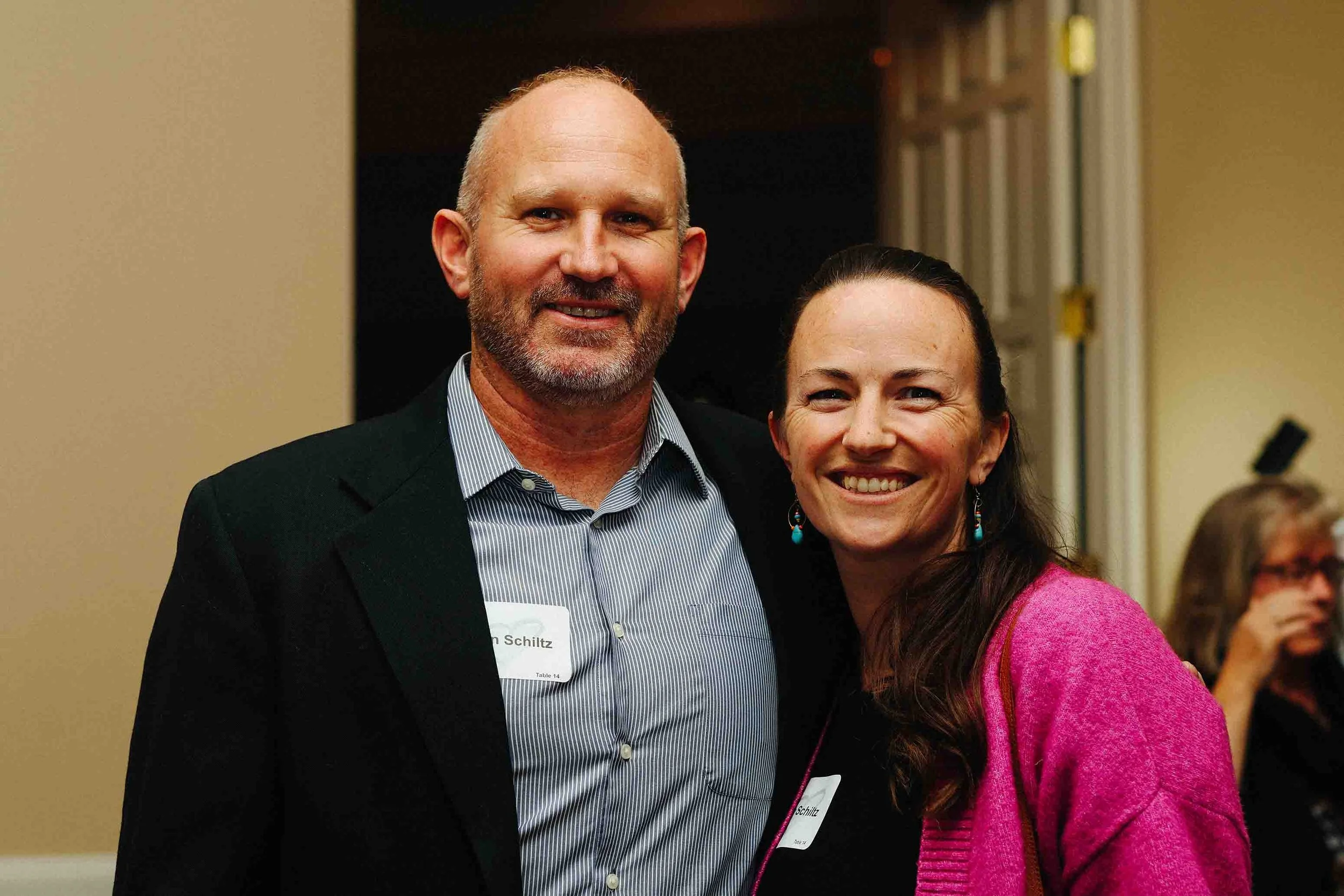 Man and woman posing at a fundraiser event