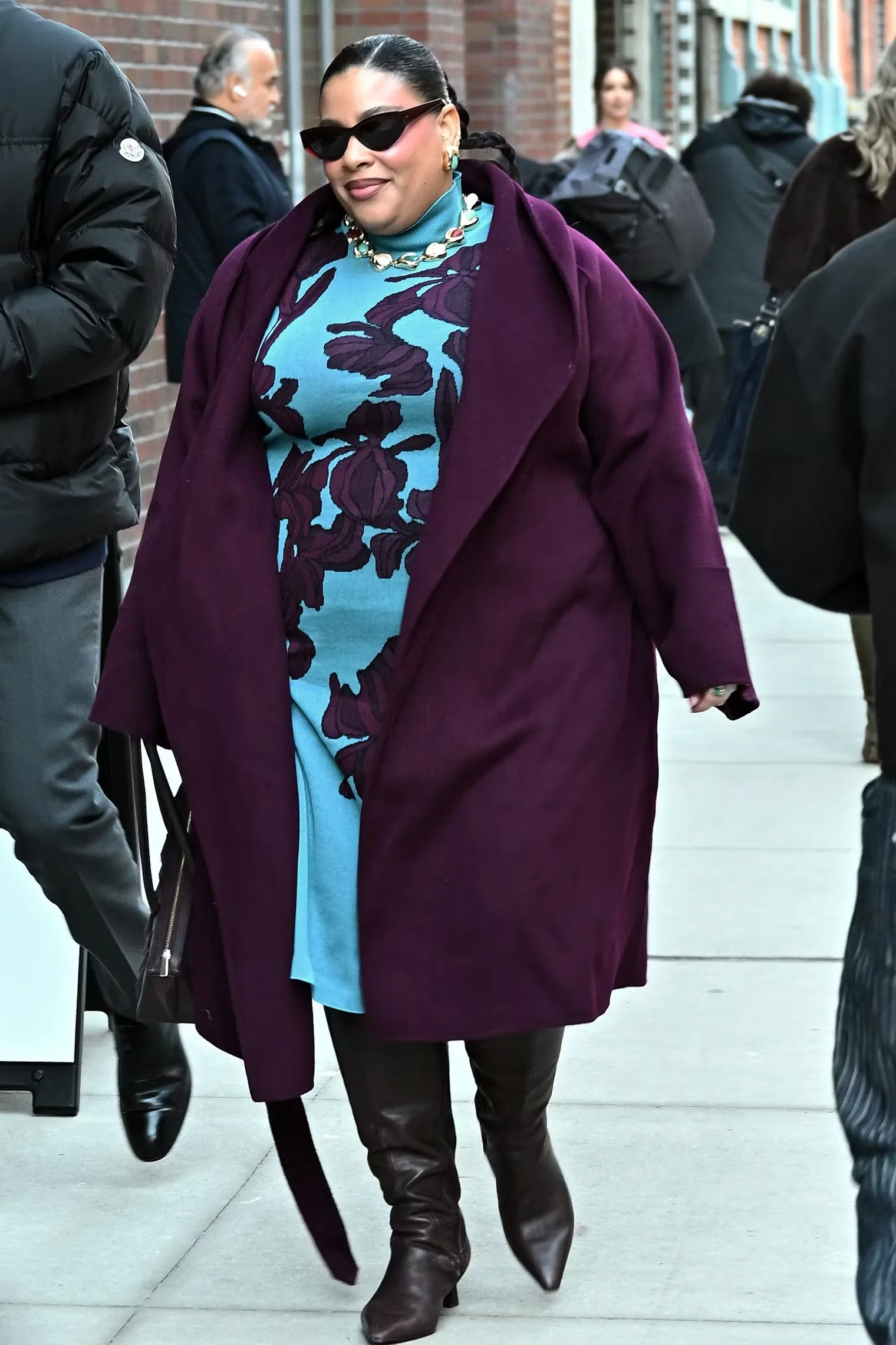 Greivy photographed at New York Fashion Week Fall/Winter 2026 showcasing the side-part hair trend featured in The Zoe Report.