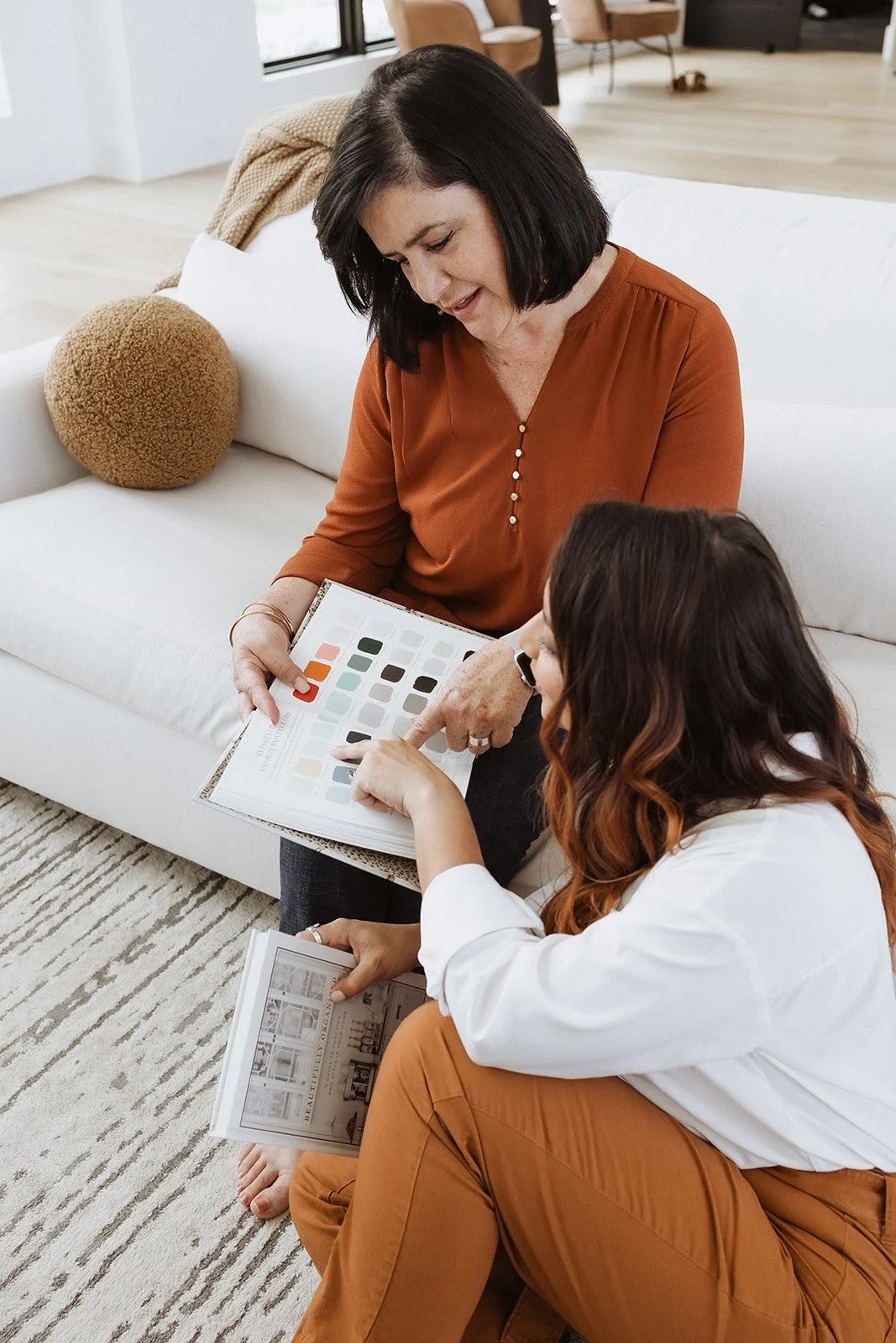 Two woman looking at color swatches