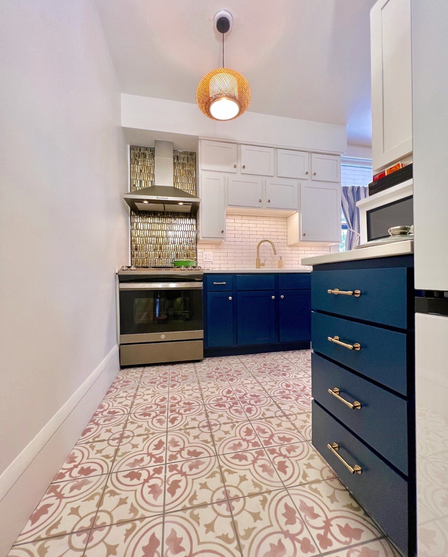 Talk about a kitchen transformation! The homeowners had planned for me to paint their dated oak cabinets, but as their dreams for the space evolved, they ended up choosing a new cabinet layout. I painted the new hickory cabinets and all the surfaces 