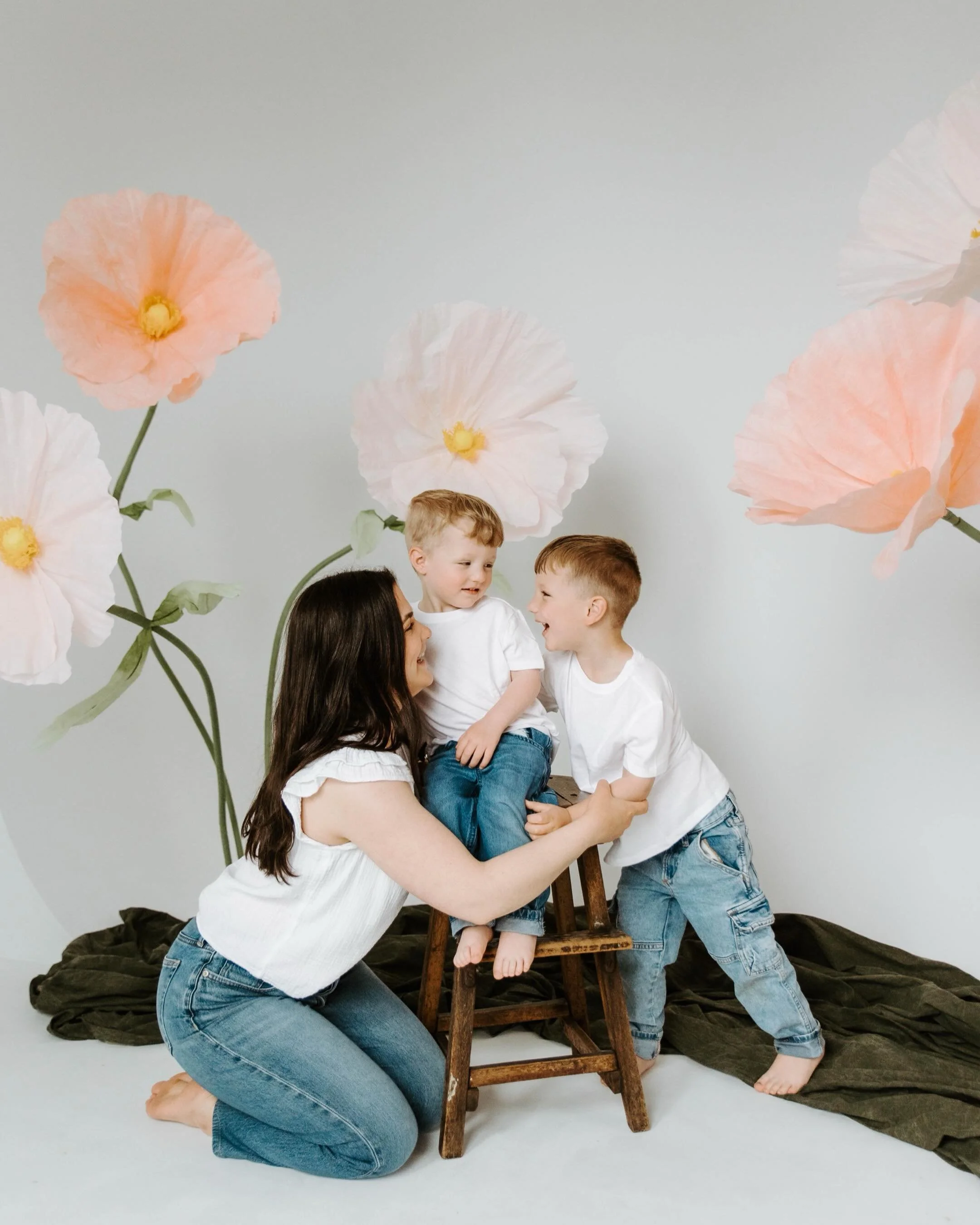 Motherhood is made up of a thousand little moments that somehow become everything. The way they reach for your hand without thinking, the giggles between shots, the comfort of being held by mom.

One day these tiny faces will grow, the curls will str