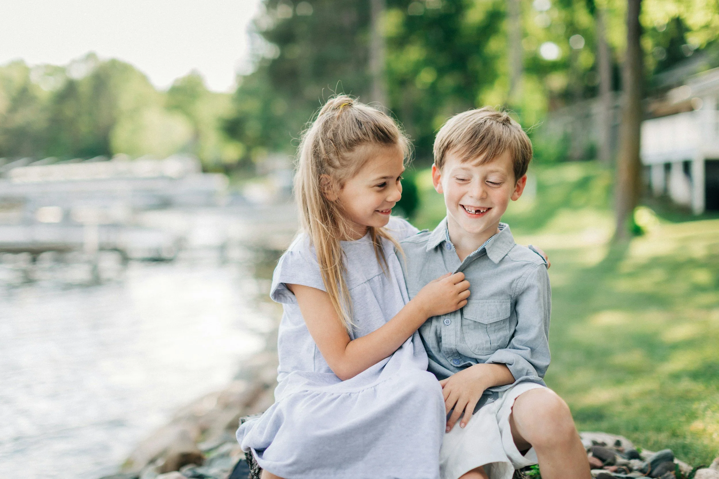 Boy and girl outside boy missing front teeth