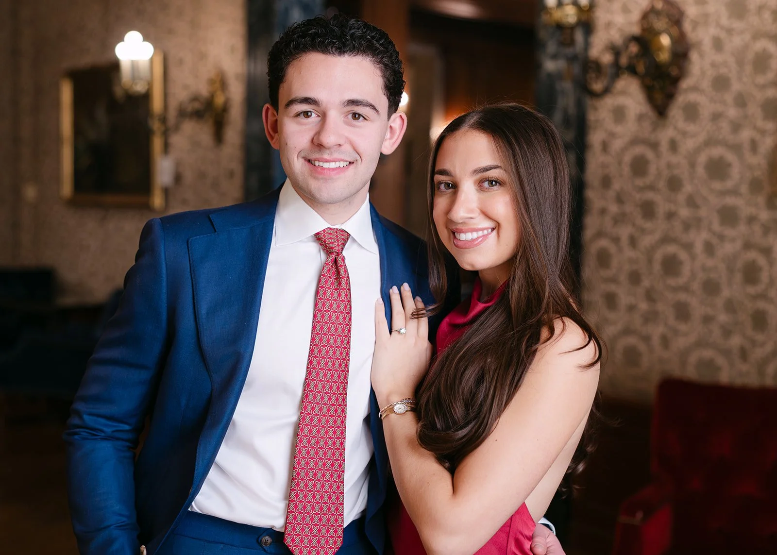 Close up photo of a couple smiling at the camera.