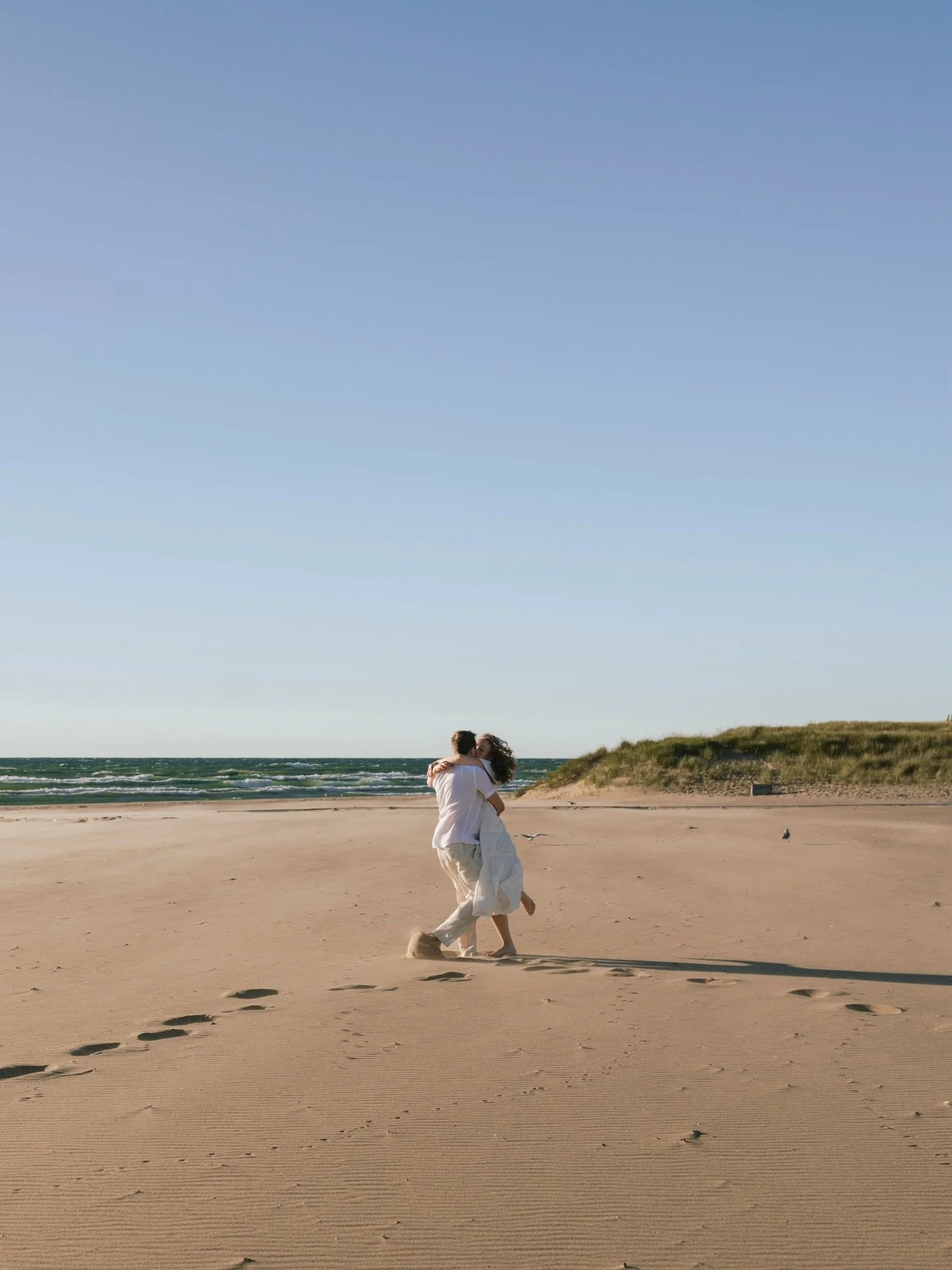 That west side of Michigan sun did not disappoint at Kelsey and Payton&rsquo;s beach engagement session! 

Bare feet. Windblown hair. A little bit of wandering, a whole lot of being themselves. This is what happens when you simply enjoy the moment to