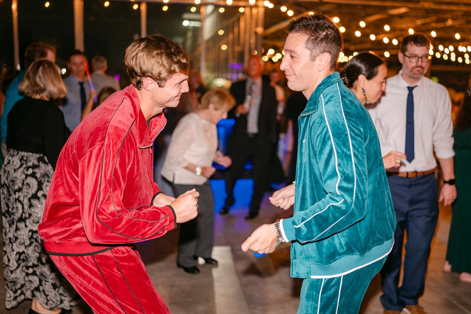 Groomsmen dancing in colorful Velour Tracksuits