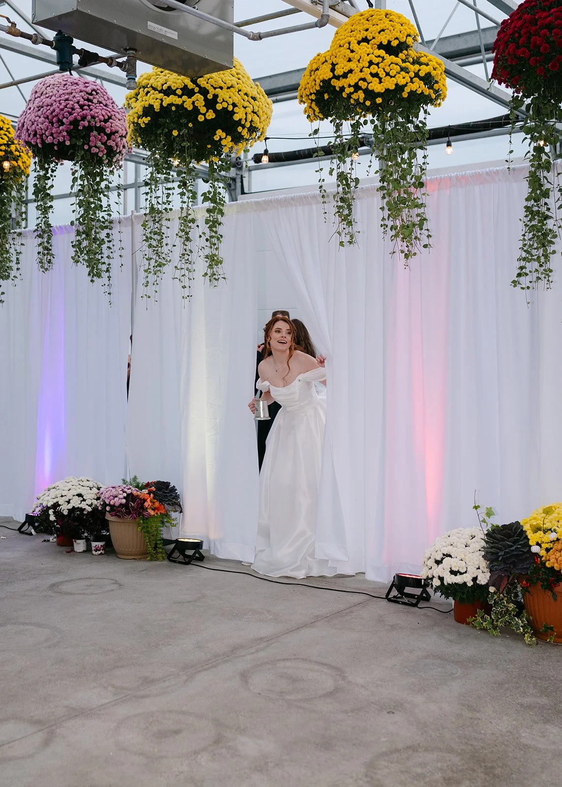 Bride and groom entering their Abele Greenhhouse wedding reception.