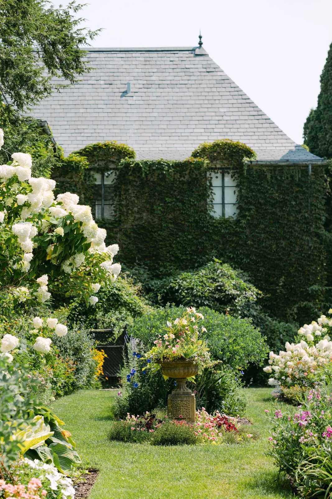 A lush photo of the gardens on the grounds of Greencrest Manor, an estate wedding venue in Michigan.
