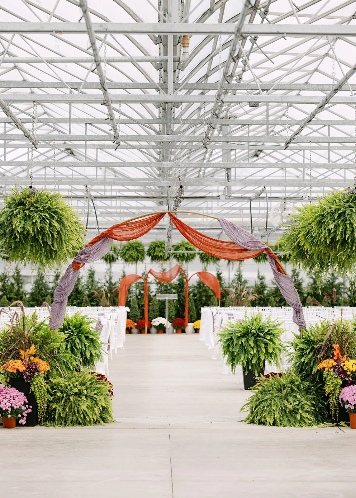 Ceremony setup inside Abele Greenhouse wedding venue in Saginaw, Michigan.