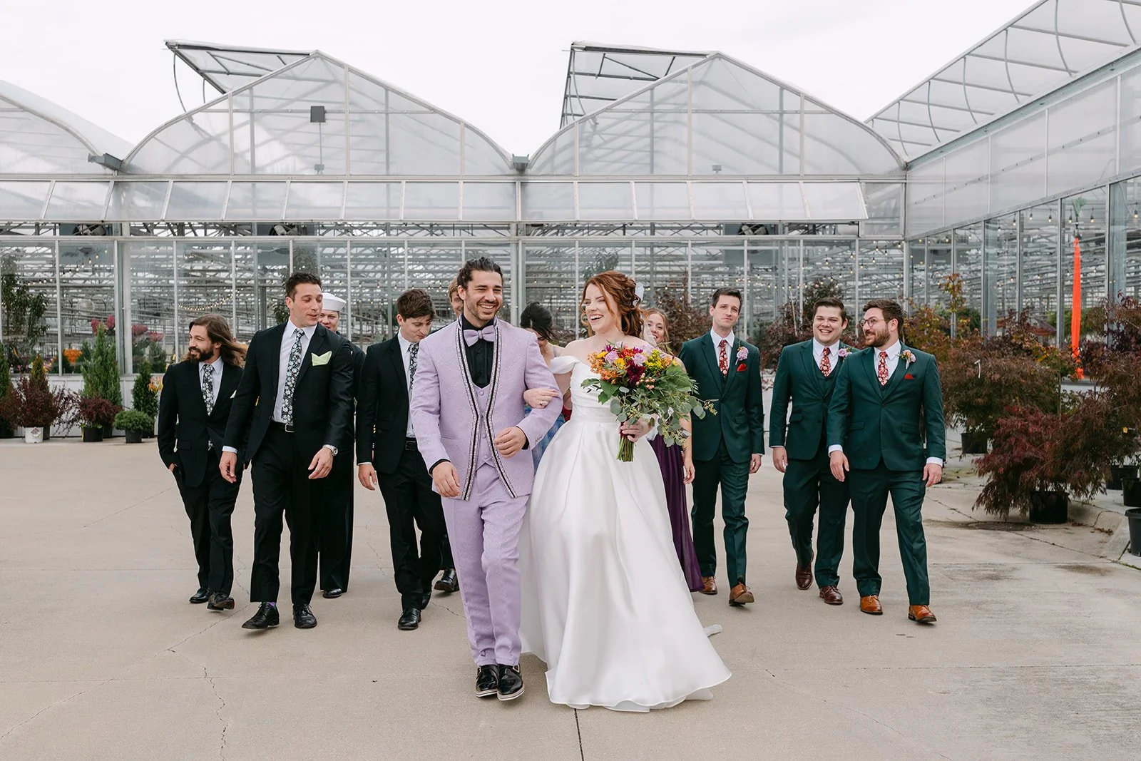 Outdoor wedding party photos outside of Abele Greenhouse in Saginaw, Michigan.