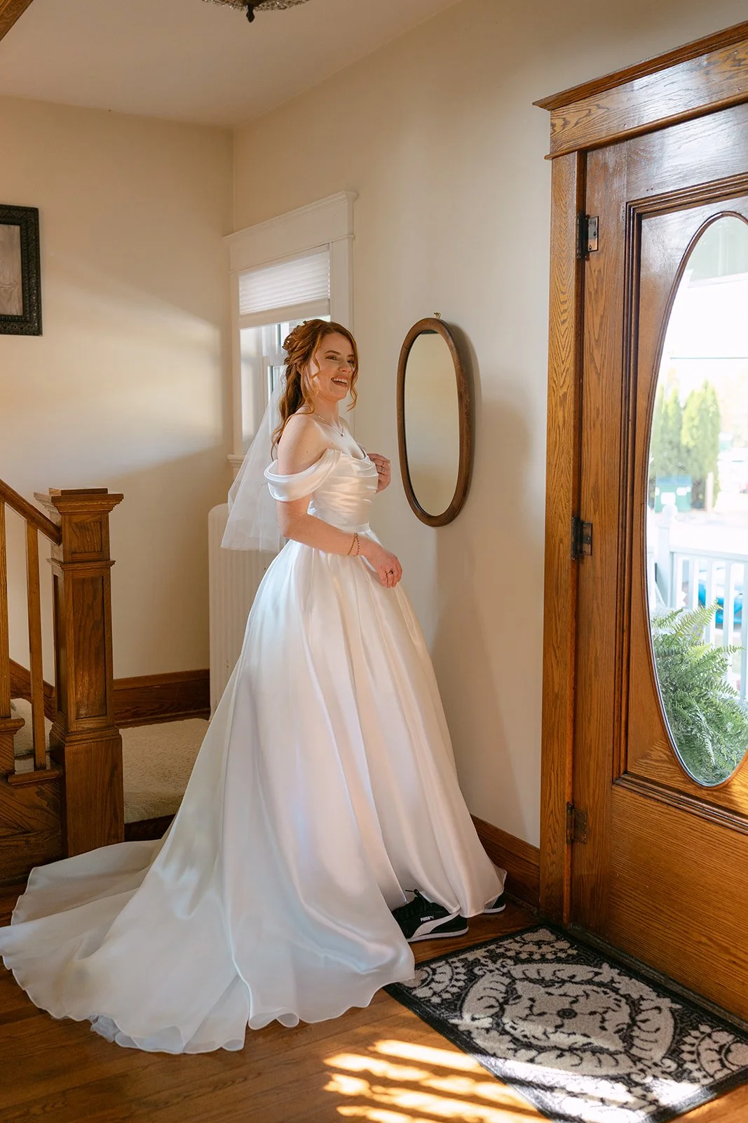 Bride posing in front of the front door at Brownstone Haus in Frankenmuth, Michigan.