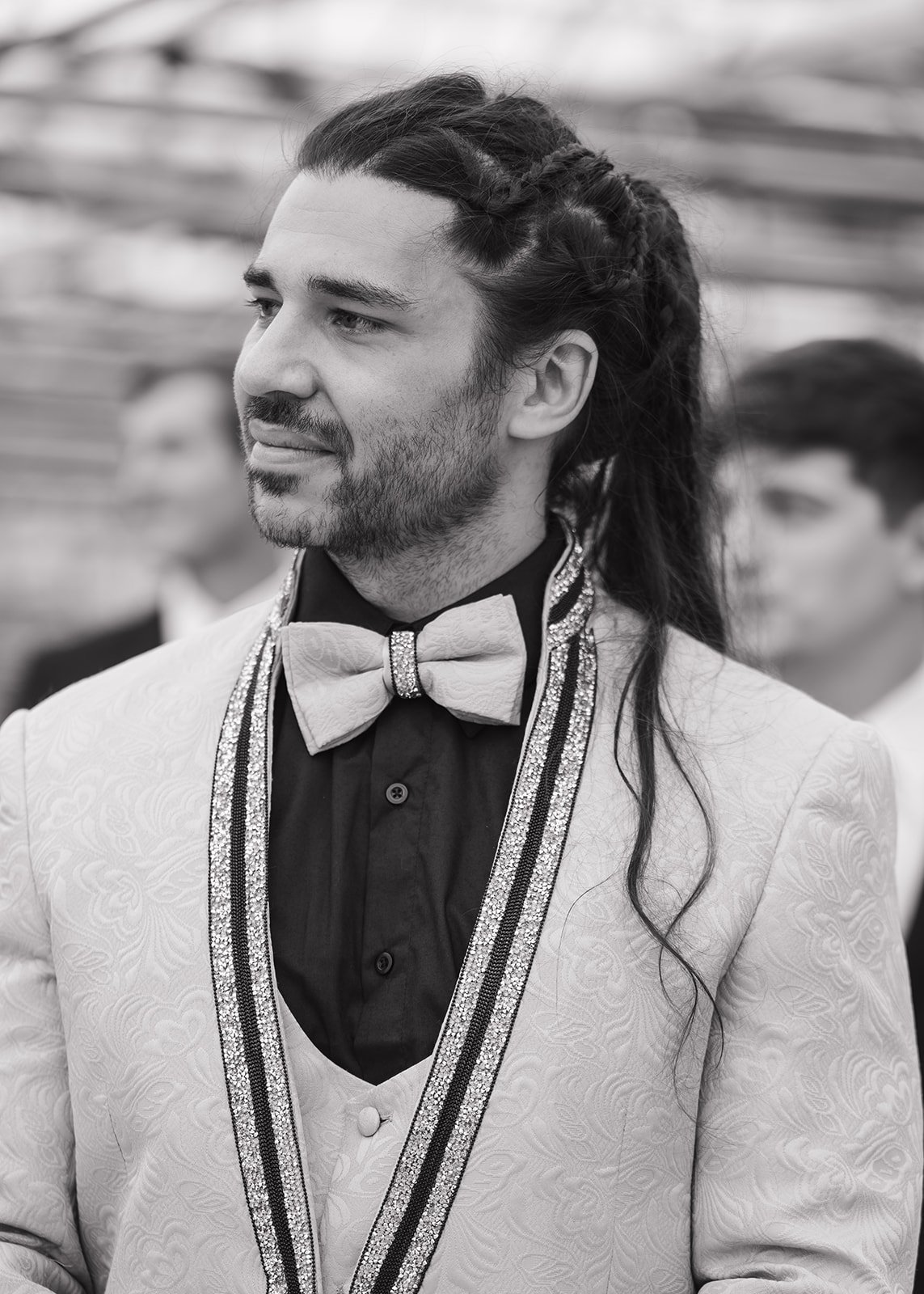 Groom waiting during Abele Greenhouse wedding ceremony in Saginaw, Michigan.