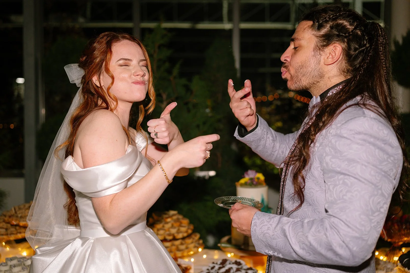 Bride and groom eating their wedding cake.