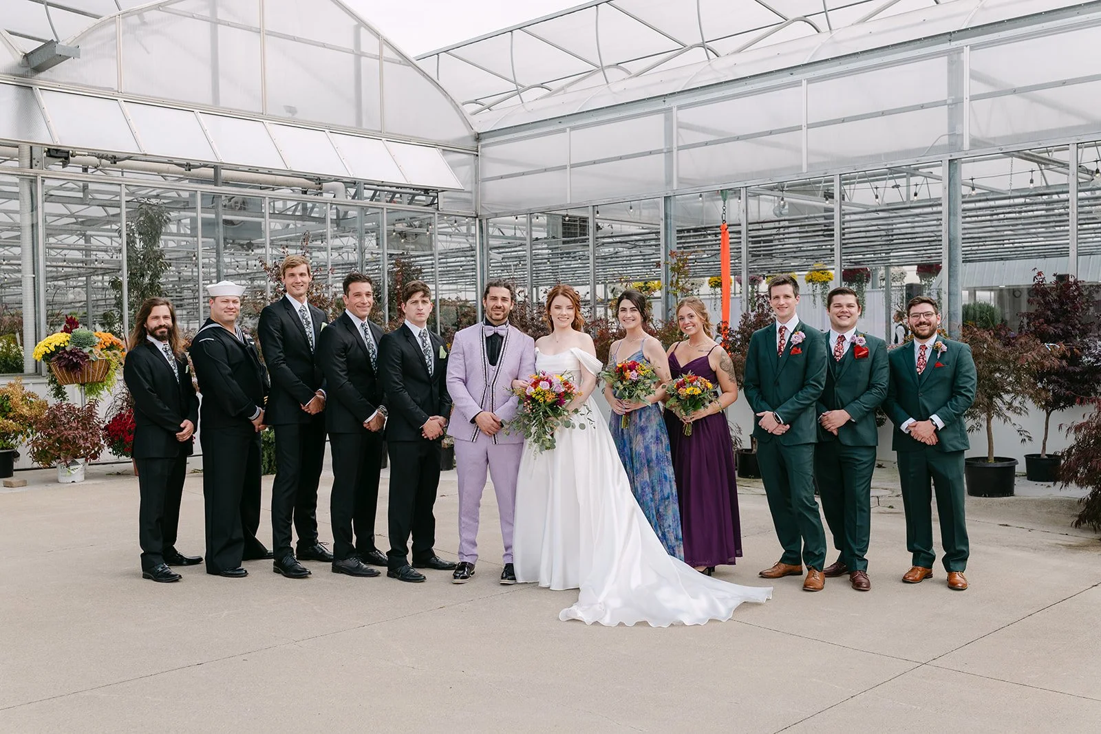 Outdoor wedding party portraits outside of Abeles Greenhouse in Saginaw, Michigan.