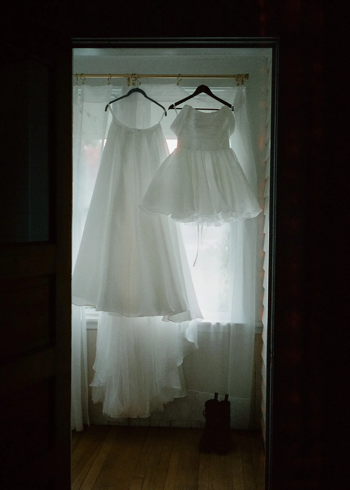 Film photo of the brides dress and boots.