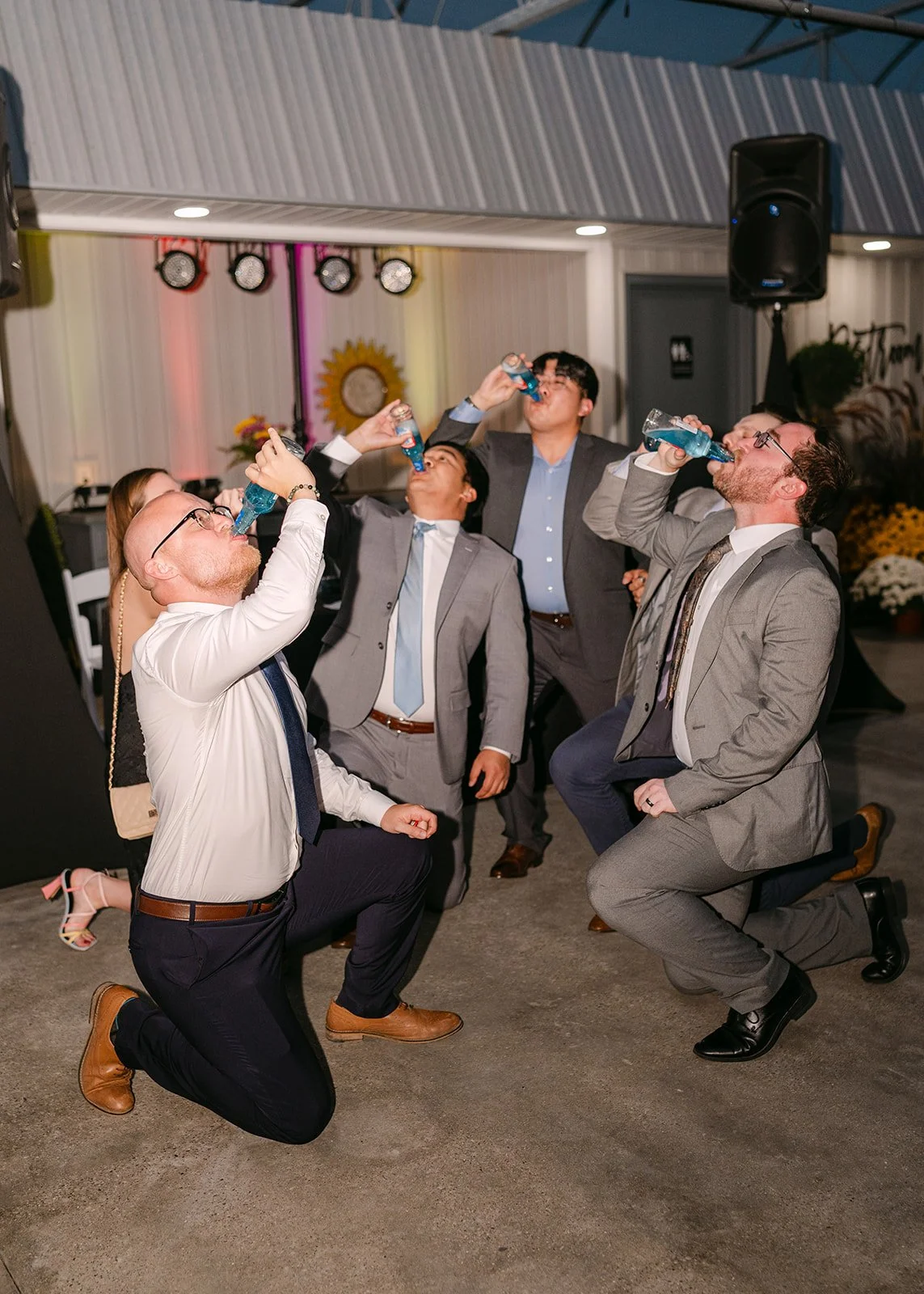 Groomsmen getting iced during a Saginaw wedding reception.