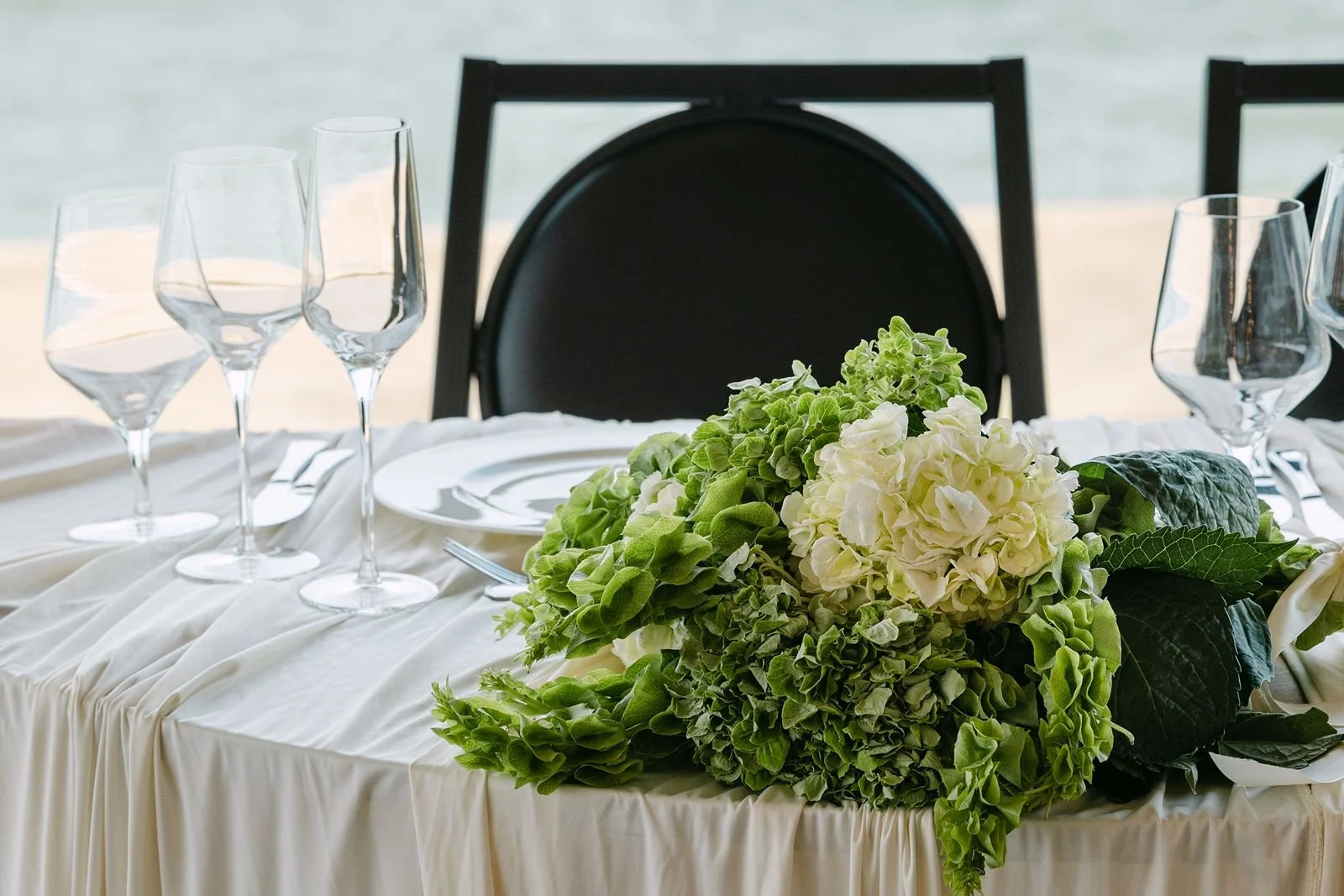 Bride's bouquet resting at the sweetheart table.
