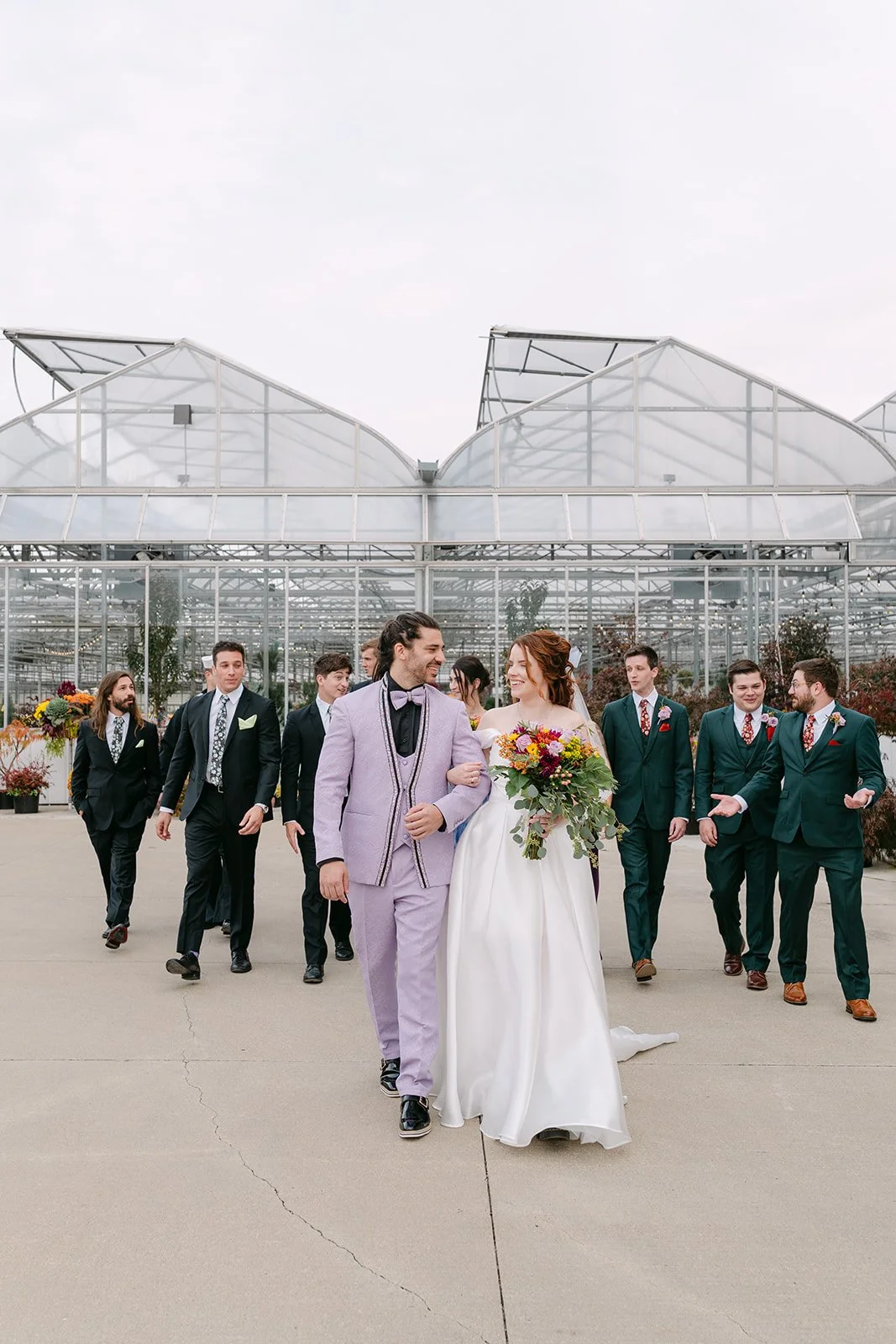 Outdoor wedding party portraits outside of Abeles Greenhouse in Saginaw, Michigan.