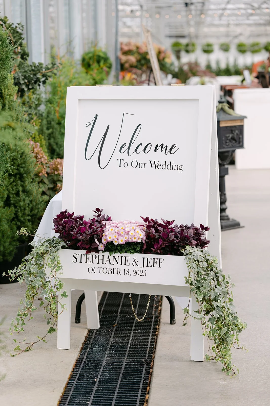 Welcome To Our Wedding signage at Abeles Greenhouse in Saginaw, Michigan.
