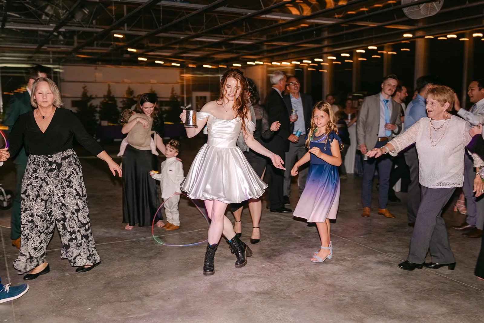Bride dancing during Abele Greenhouse wedding reception in Saginaw, Michigan.
