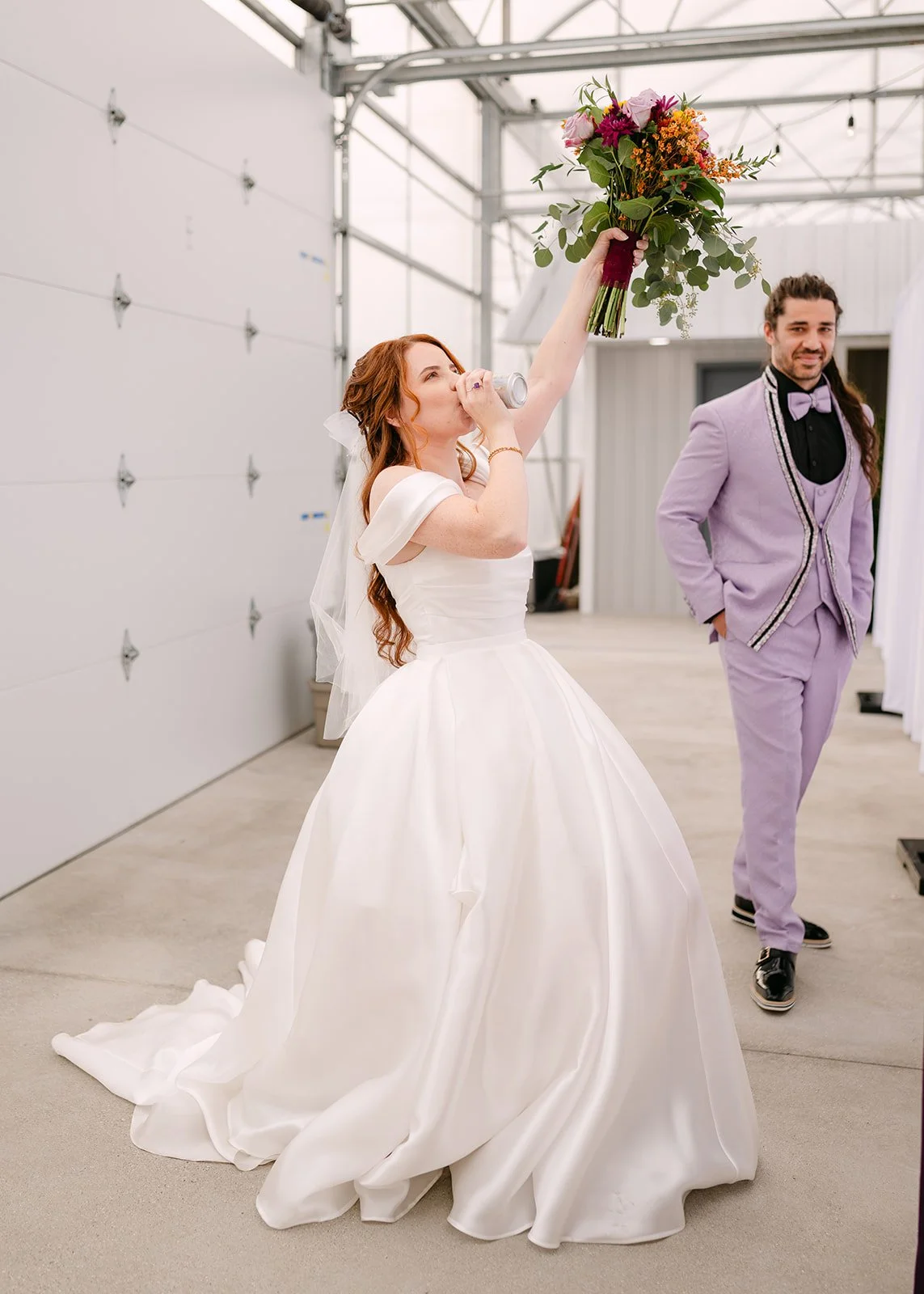 Bride having a drink during cocktail hour.