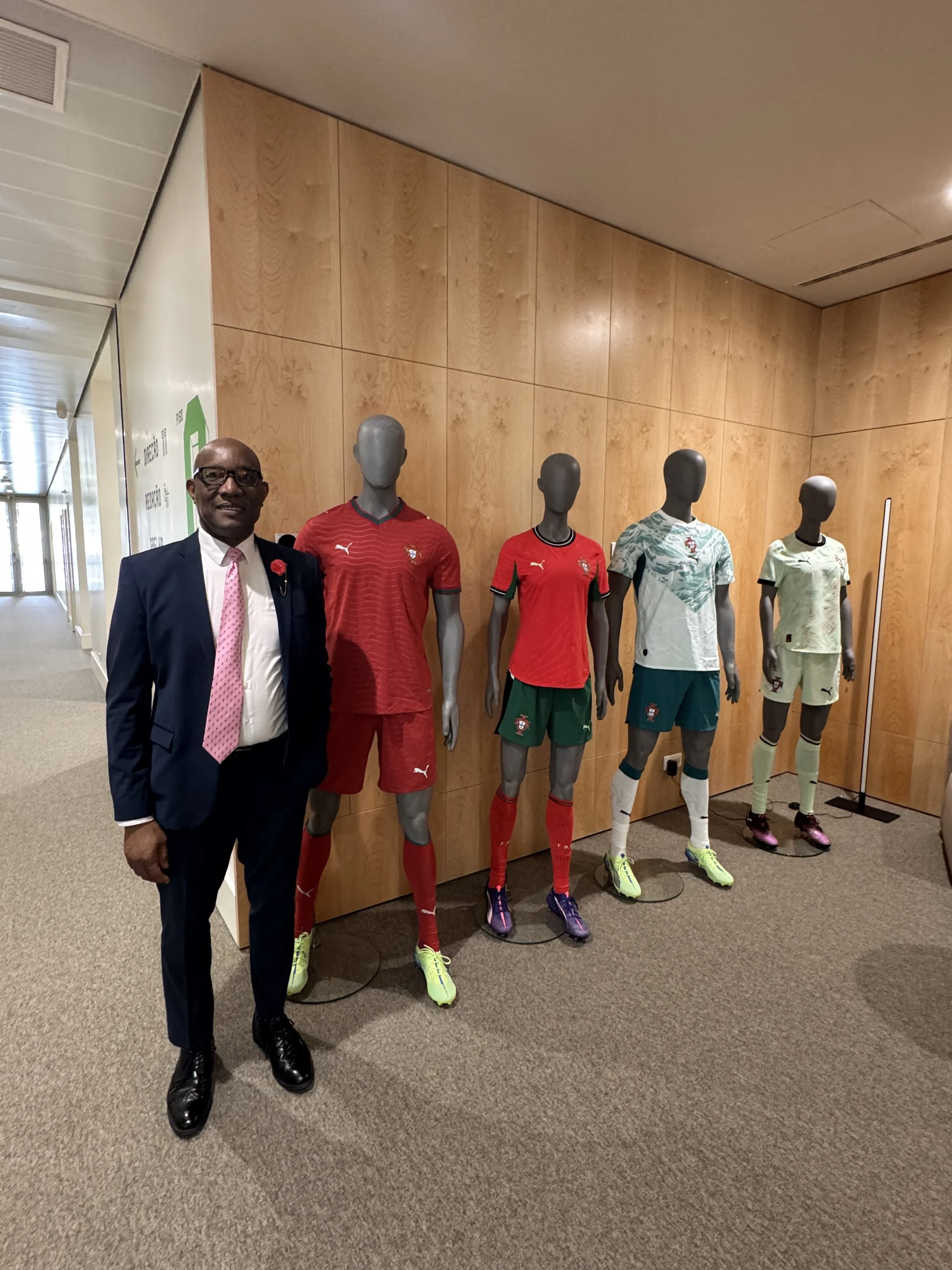 Football meets diplomacy! Dr. Philbert Aaron — lifelong football fan — living the dream next to the official Portugal national team kits at the Portuguese Football Federation in Lisbon. Yes, the home of Cristiano Ronaldo. No, he didn't try one on. (M