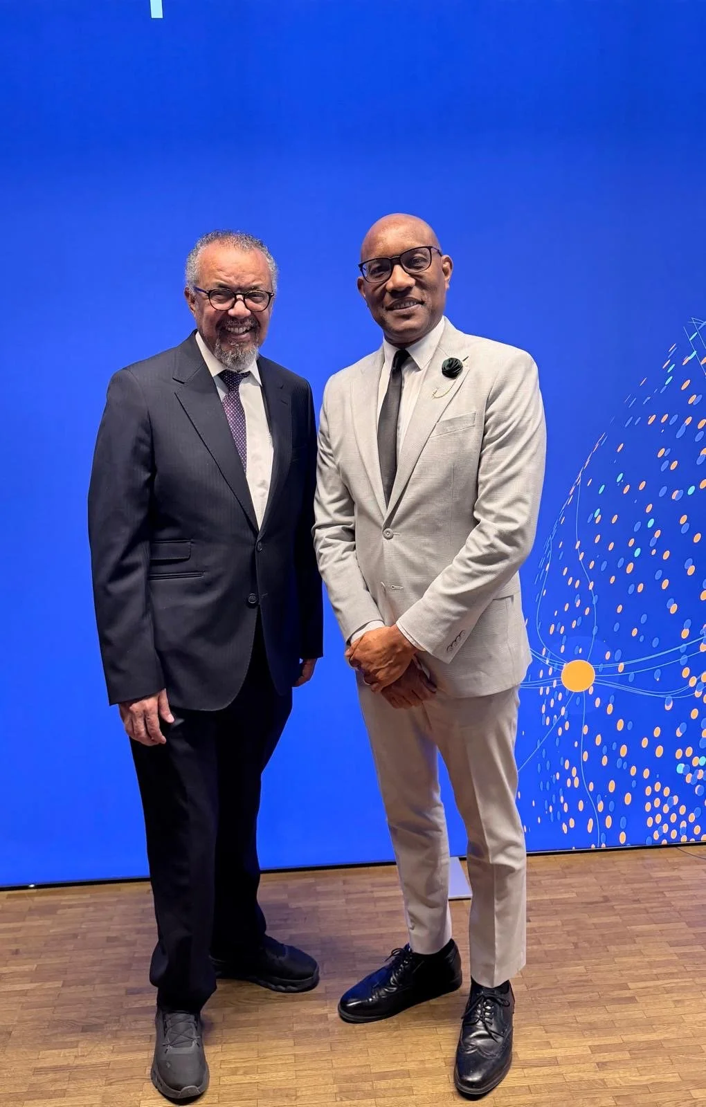 Dr. Philbert Aaron with WHO Director-General Dr. Tedros Adhanom Ghebreyesus in Berlin, Germany (April 2026) — connecting Eastern Caribbean diplomacy with global health leadership.