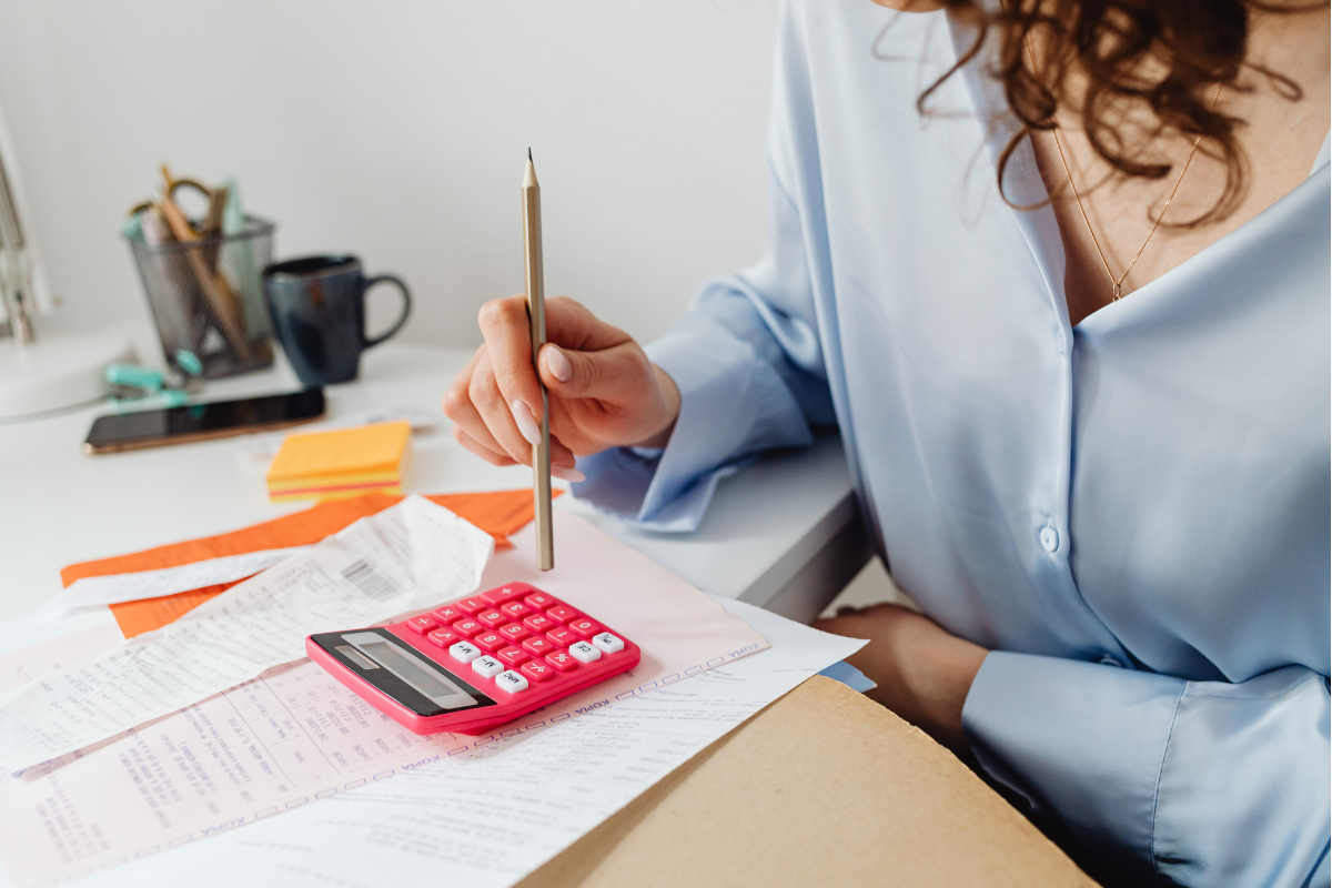 A woman calculating her education expenses