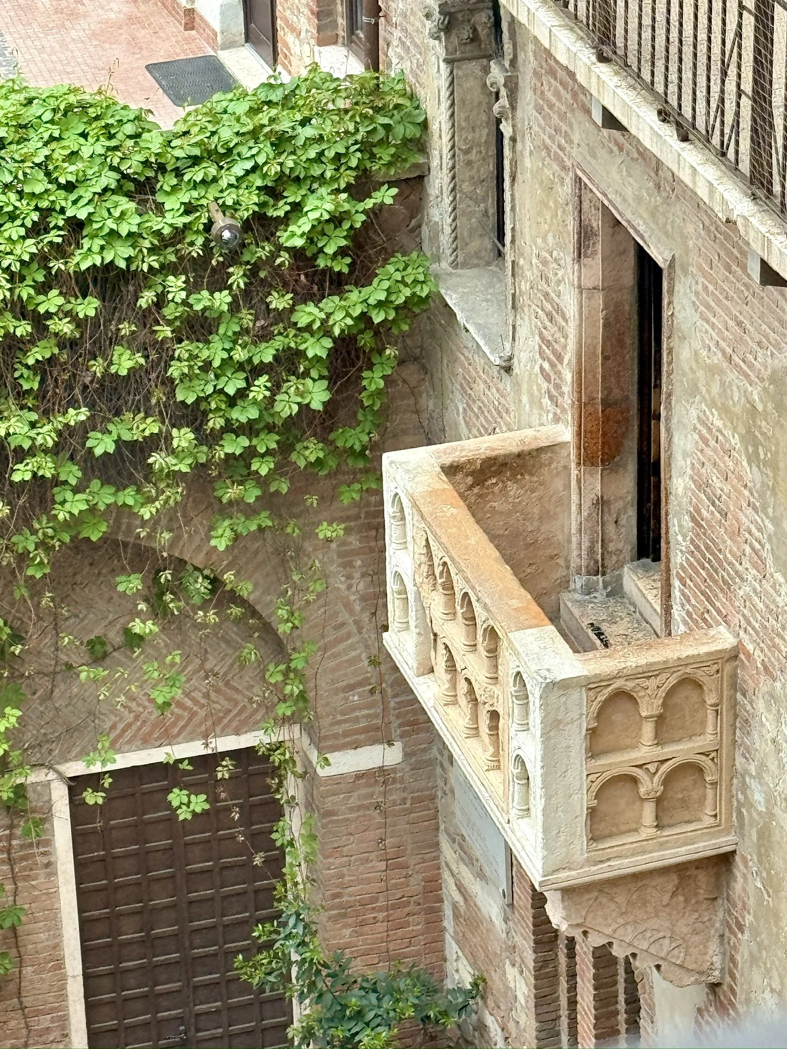 Looking down on "Juliet's Balcony" in Verona.  Yes, Terri and I kissed on the balcony.  No, I did not climb up.