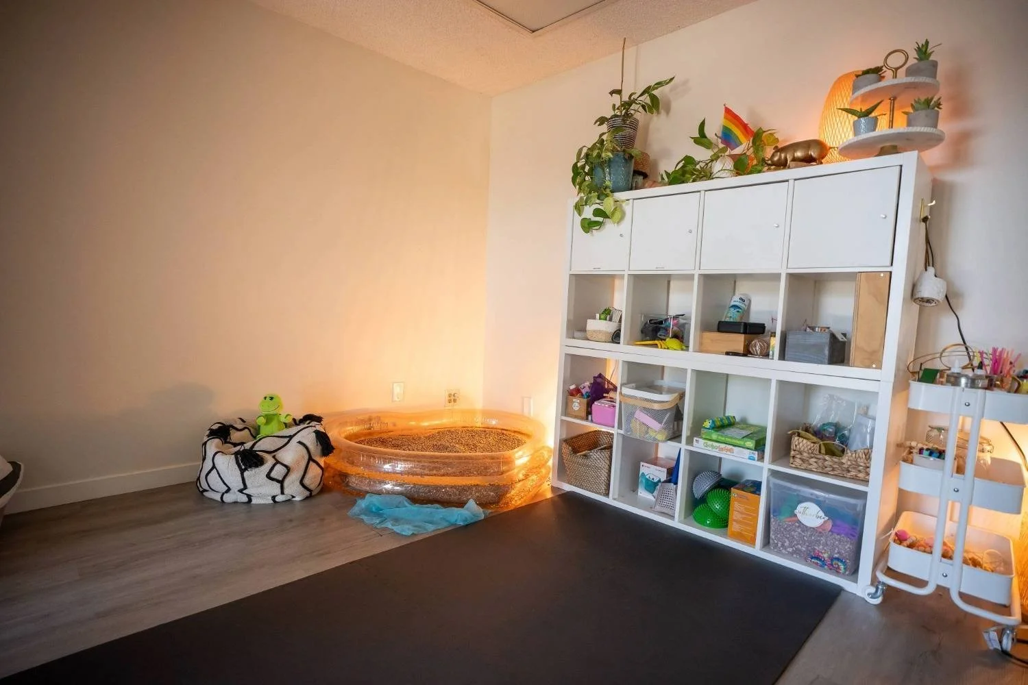 Spacious pediatric therapy room with sensory equipment and movement activities at Wetherbee Pediatric Therapy
