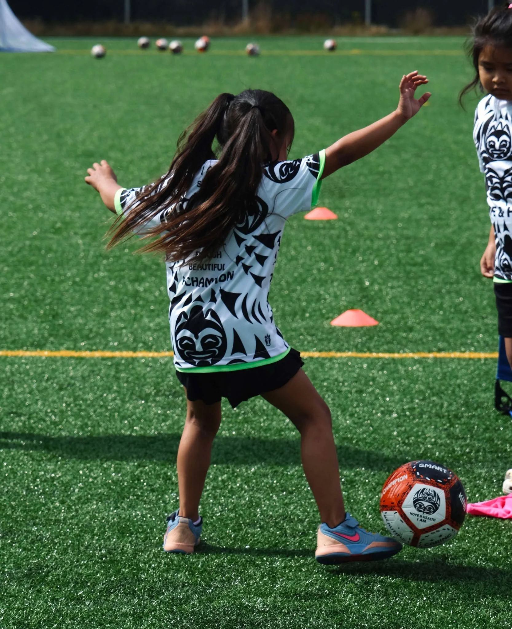 H&H Girl Kicking ball.jpg