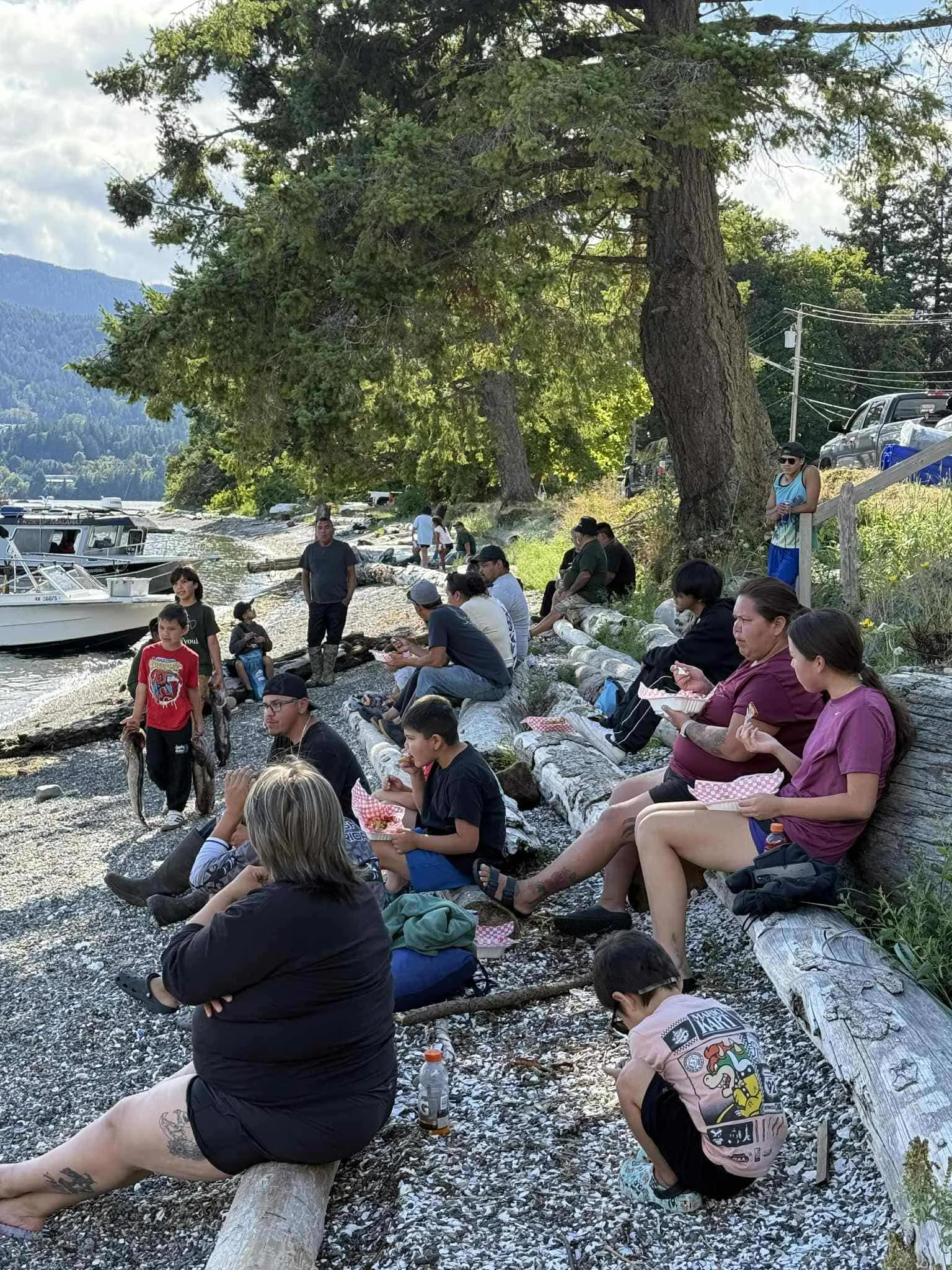 Community members enjoying time on shore.jpg