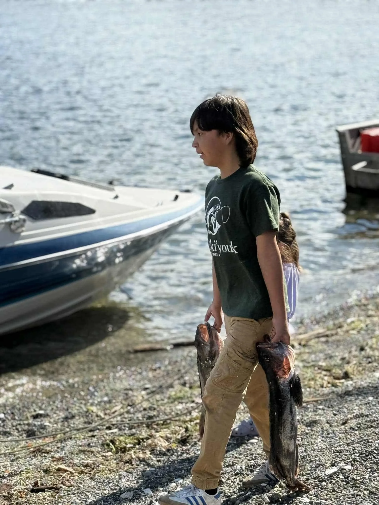 Kiddo carrying his catches.jpg
