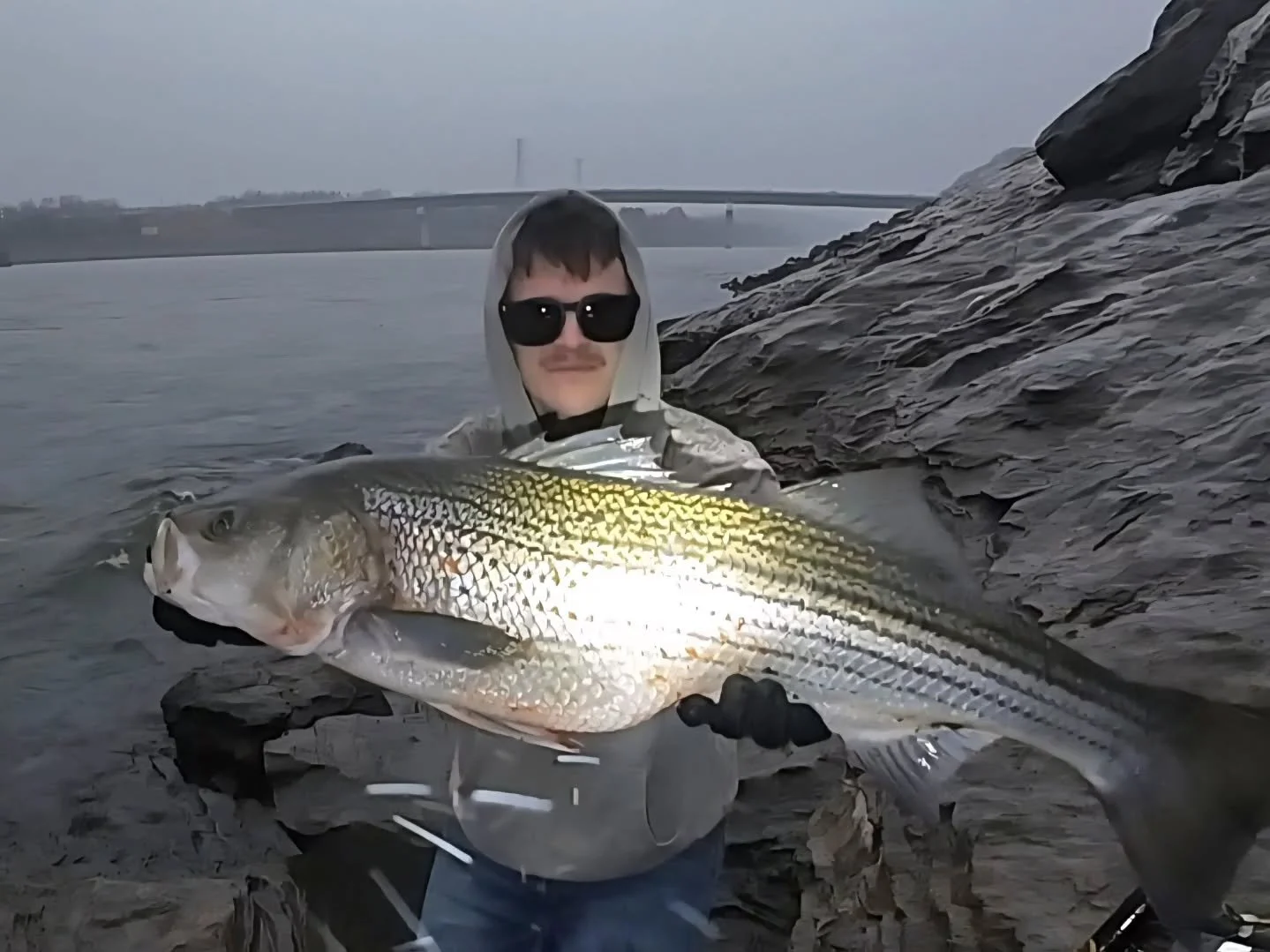 Another Striper falls victim to the XL Banshee!! 18.3 lbs! I caught this guy on my 5th cast this morning, mid fight it started pouring rain, and this spot is SKETCHY in heavy rain (slippery rocks above dangerous currents) so I skedaddled on back to m