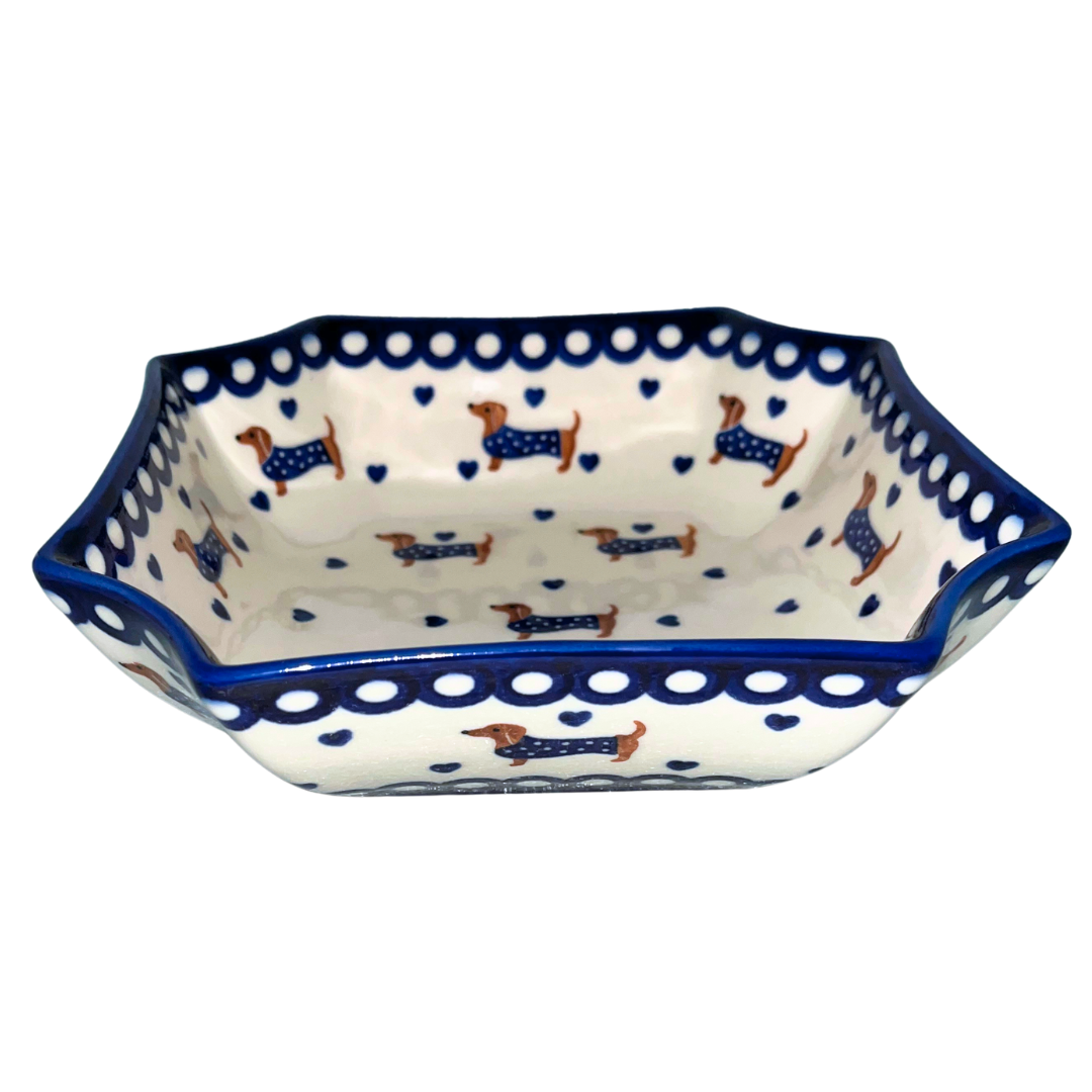 Ceramika Kalich Pattern 1322 Dachshunds features playful dachshunds in blue coats with scattered blue hearts and cobalt accents. Hand-painted Polish pottery from Poland.