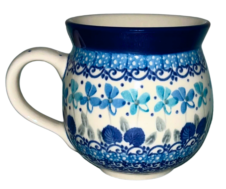 Ceramika Artystyczna Polish pottery in pattern 2898X Little Gems features intricate cobalt and teal florals with a textured gem-like center. Handmade stoneware from Bolesławiec, Poland.