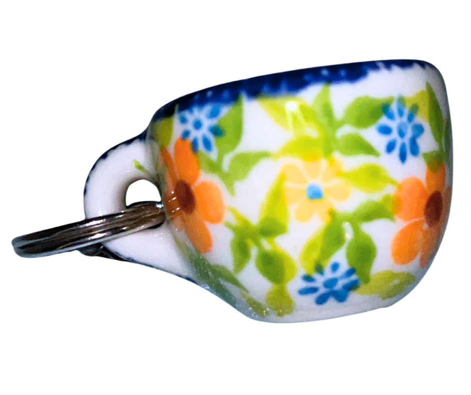 Hand-painted Polish Pottery key chain from Bolesławiec, Poland. Mini cup charm with floral design and metal clasp—perfect for keys, bags, or gifts.