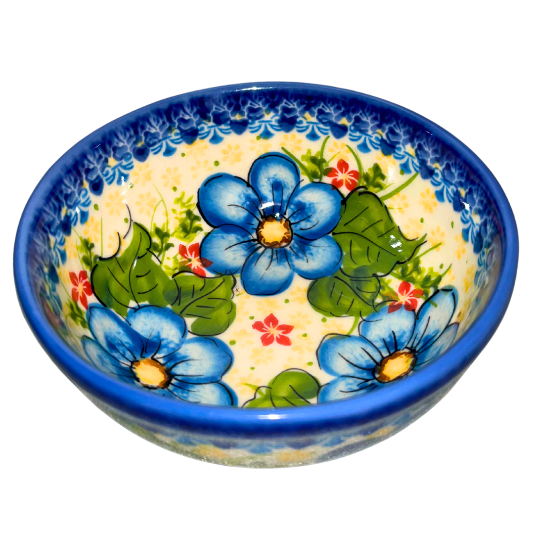 Kalich Polish Pottery 1007 Beautiful Blue floral pattern, hand-painted Bolesławiec stoneware bowl with cobalt rim, blue flowers, green leaves, and red accents, UNIKAT quality.