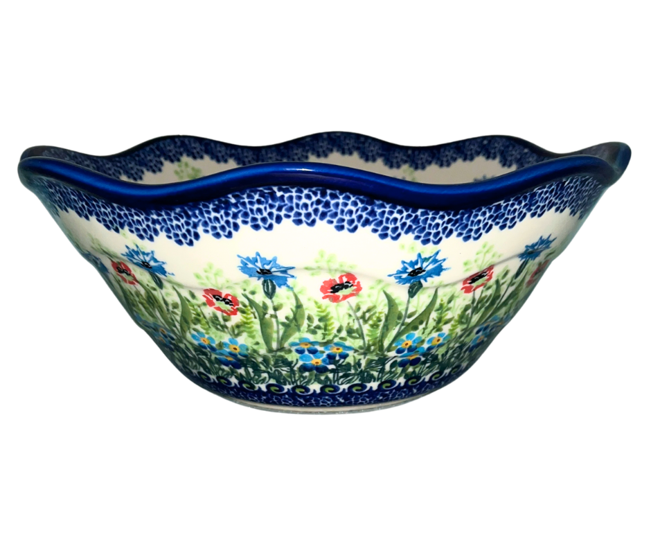 Hand-painted Kalich Polish pottery Viki bowl featuring wildflowers, poppies, and forget-me-nots with a scalloped rim. Durable stoneware, dishwasher, microwave, and oven safe.