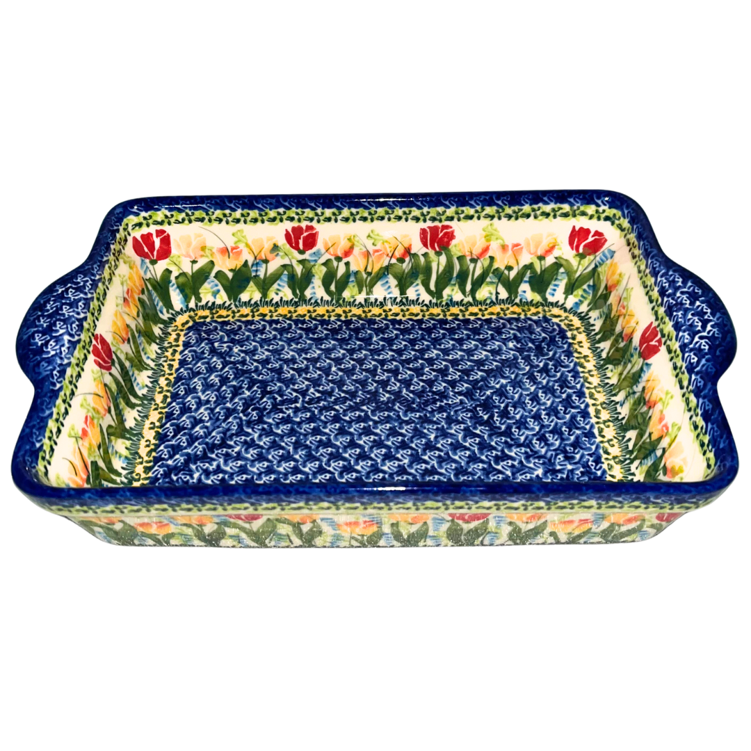 Kalich Polish Pottery Pattern 591 Tulips, hand-painted red and yellow floral design with cobalt accents, Bolesławiec stoneware, durable, dishwasher and microwave safe, vibrant spring pattern.