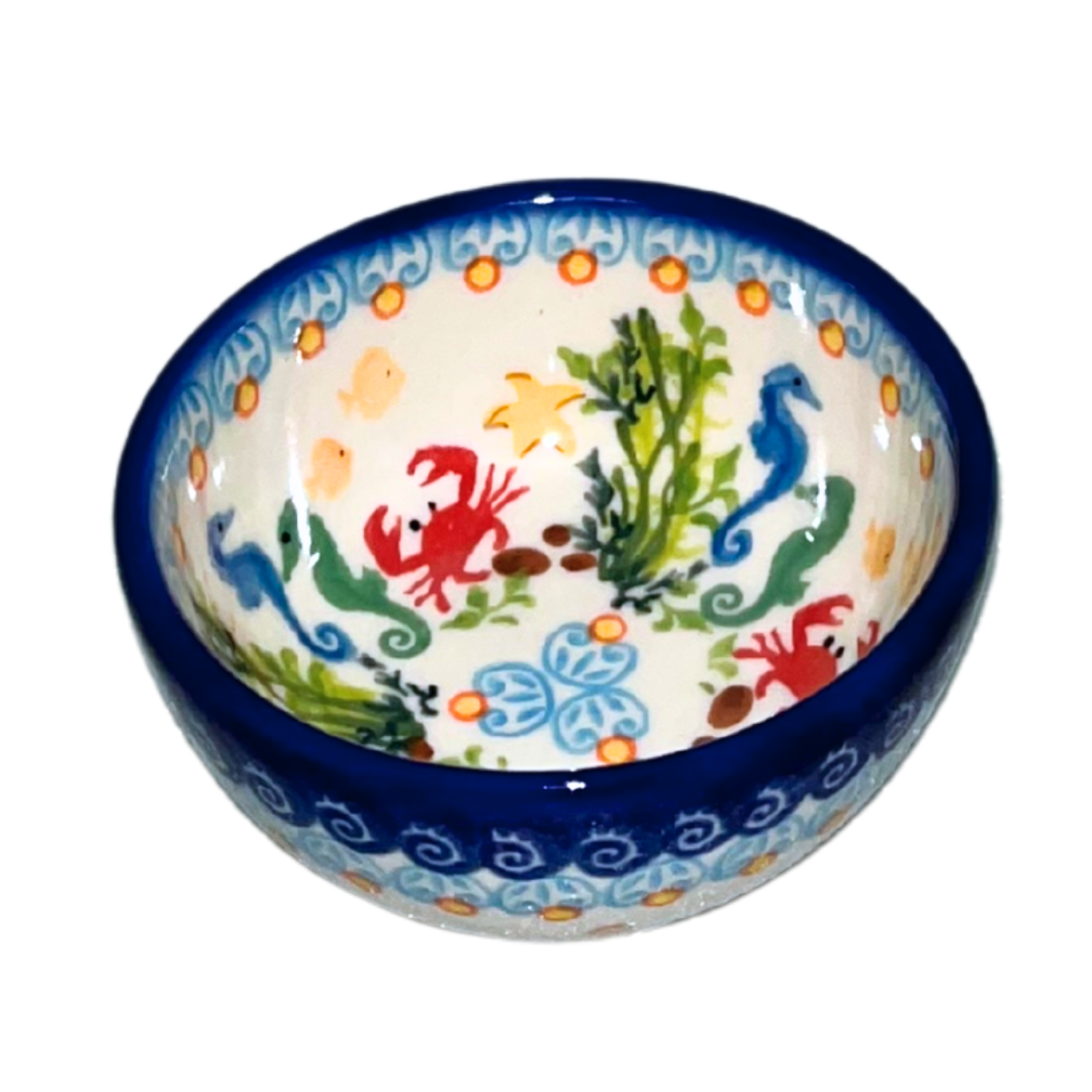 Handmade Ceramika Kalich Polish pottery in Pattern 884 Sealife with Red Crabs. Colorful coastal design featuring seahorses, starfish, and crabs. Microwave and dishwasher safe stoneware.