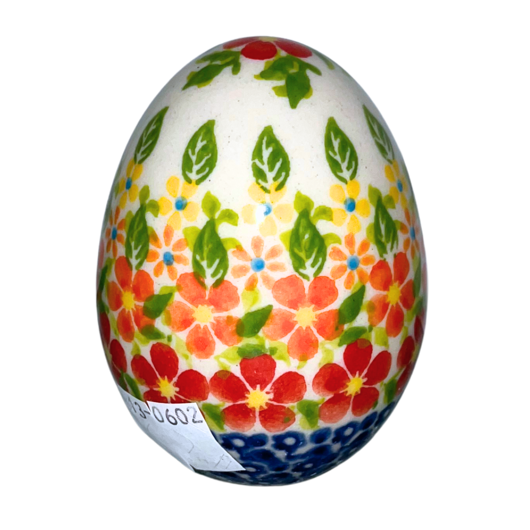 3" hand-painted Polish pottery egg with vibrant red, orange, and yellow floral design. A charming decorative accent perfect for Easter, gifts, or collectible displays.