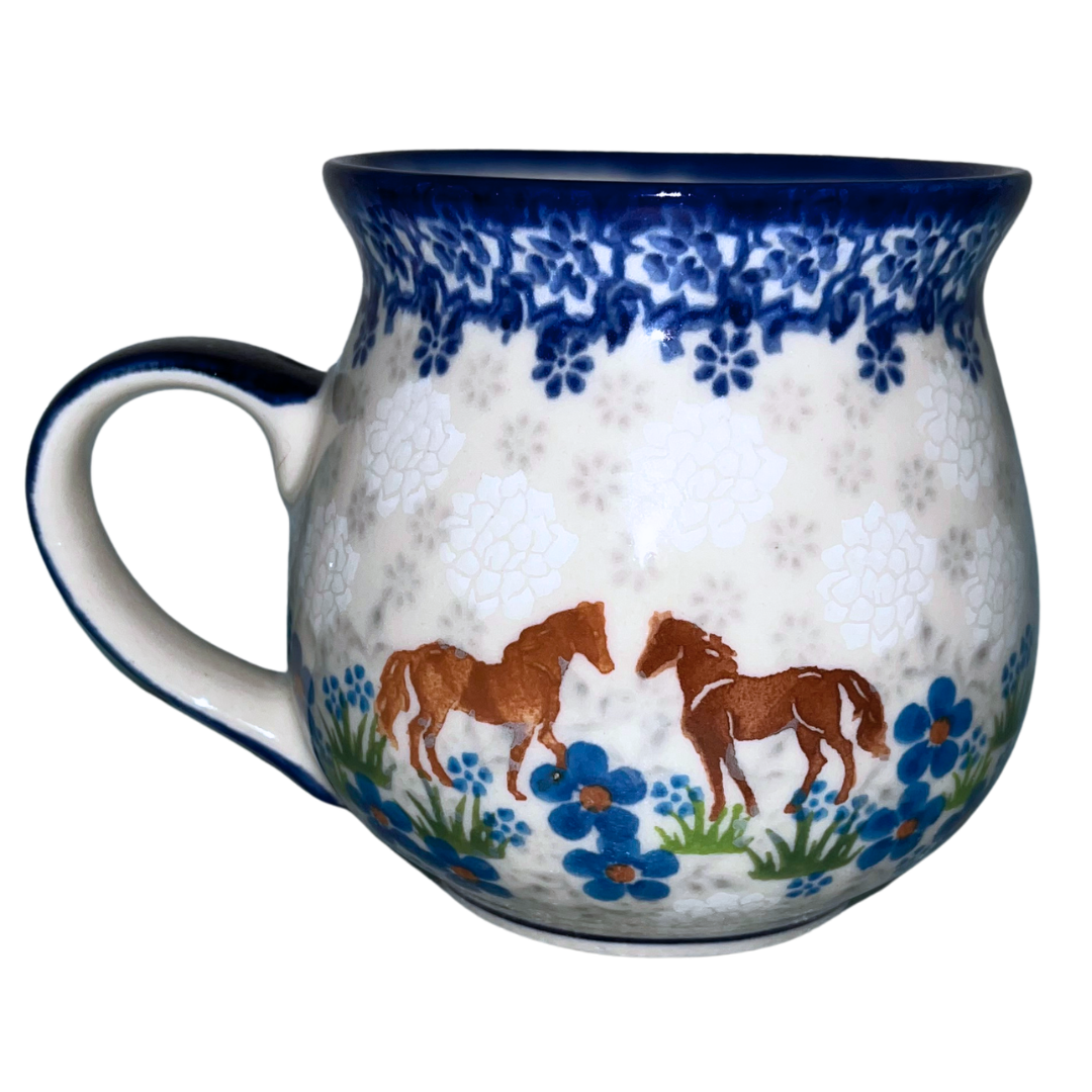 Ceramika Kalich Pattern 1311 features two horses among vibrant blue blossoms with a classic cobalt border. Hand-painted Polish pottery from Bolesławiec, Poland.