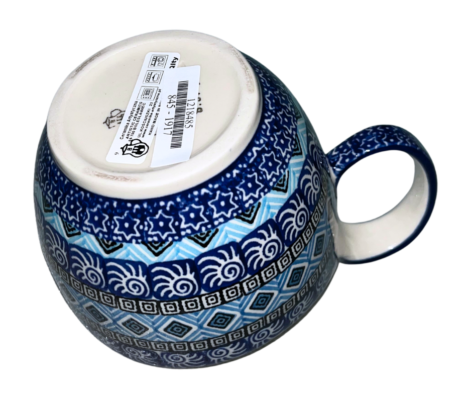 Ceramika Artystyczna 1917X Aztec Sky features geometric blue, white, and black bands with diamond and spiral motifs; hand-painted modern Polish pottery design with bold symmetry.