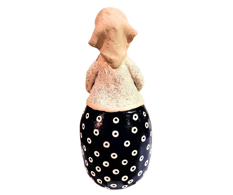 Charming hand-painted “Babcia Holding a Book” figurine featuring a Polish grandmother in an aqua scarf and floral apron. A heartwarming gift and beautiful piece of folk-inspired home décor.