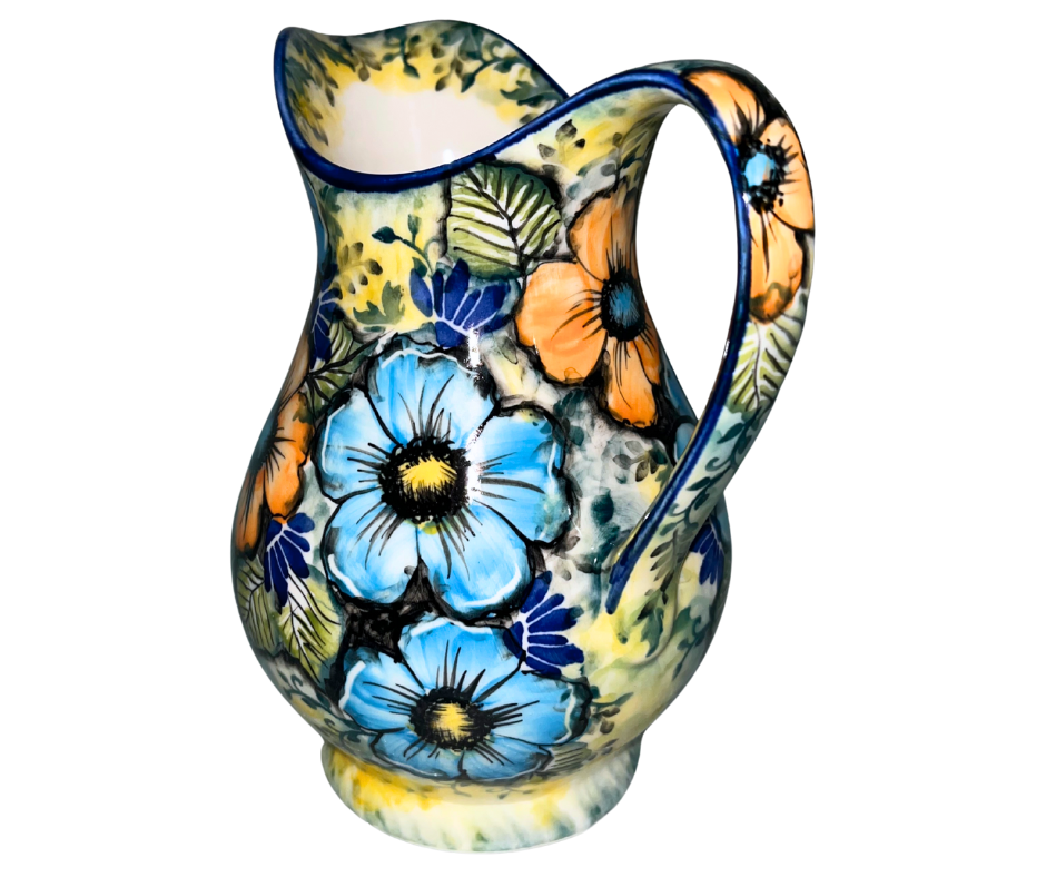 Limited Edition 2025 30 oz Kaola pitcher, hand-painted and signed by Aga K. in Bolesławiec, Poland. Vibrant blue and orange florals on luminous yellow glaze.