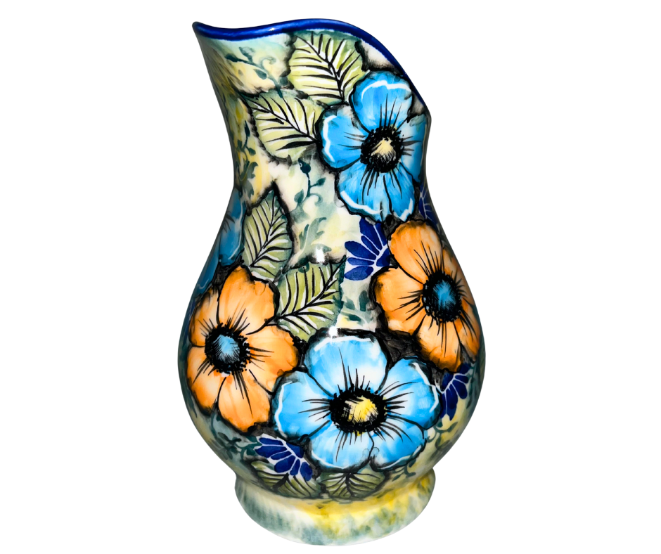 Limited Edition 2025 30 oz Kaola pitcher, hand-painted and signed by Aga K. in Bolesławiec, Poland. Vibrant blue and orange florals on luminous yellow glaze.