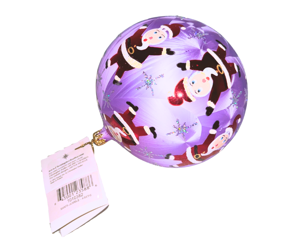 Whimsical Christopher Radko Santa Jumble ornament in lilac. Hand-blown glass with playful Santas and glittering snowflakes — a joyful, collectible holiday classic.