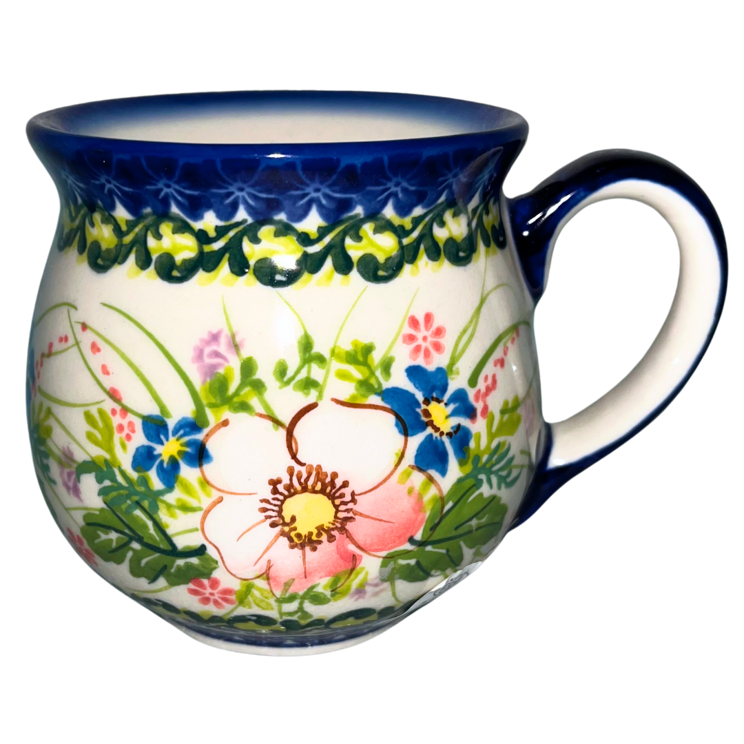 Kalich Ceramika Polish pottery Pattern 755 “Pink Ruffle” with soft pink flowers and colorful accents. Handmade stoneware, durable and dishwasher safe.